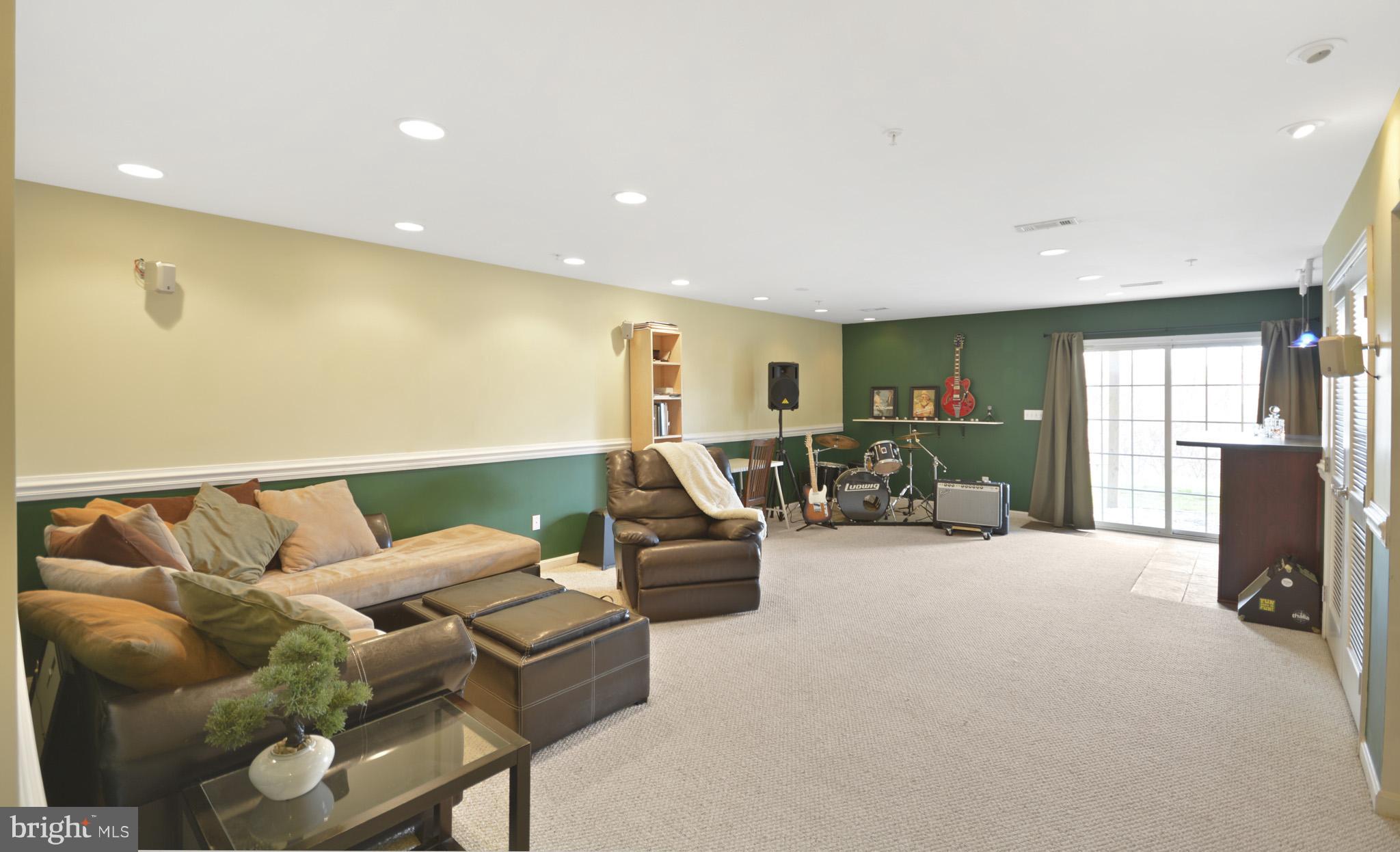 1741 Trestle Street Mount Airy, MD 21771 - Photo 20 of 30 a living room with furniture gym equipment and a window