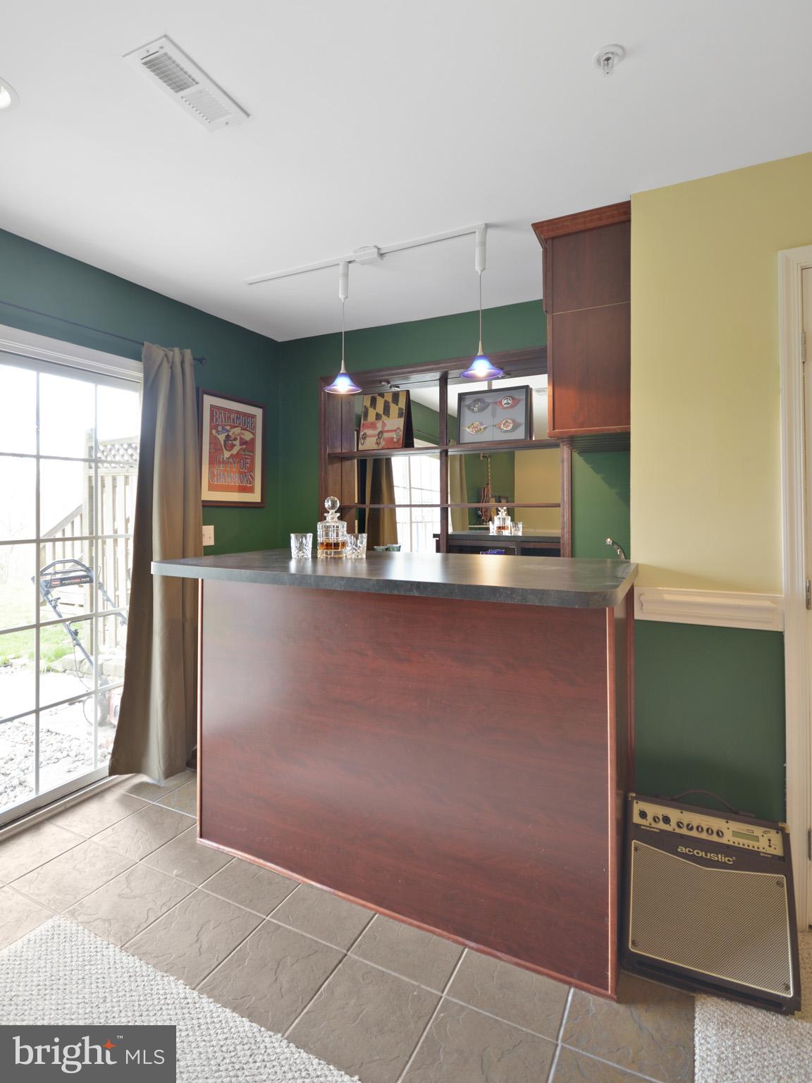 1741 Trestle Street Mount Airy, MD 21771 - Photo 21 of 30 a room with stainless steel appliances wooden floor and a large window