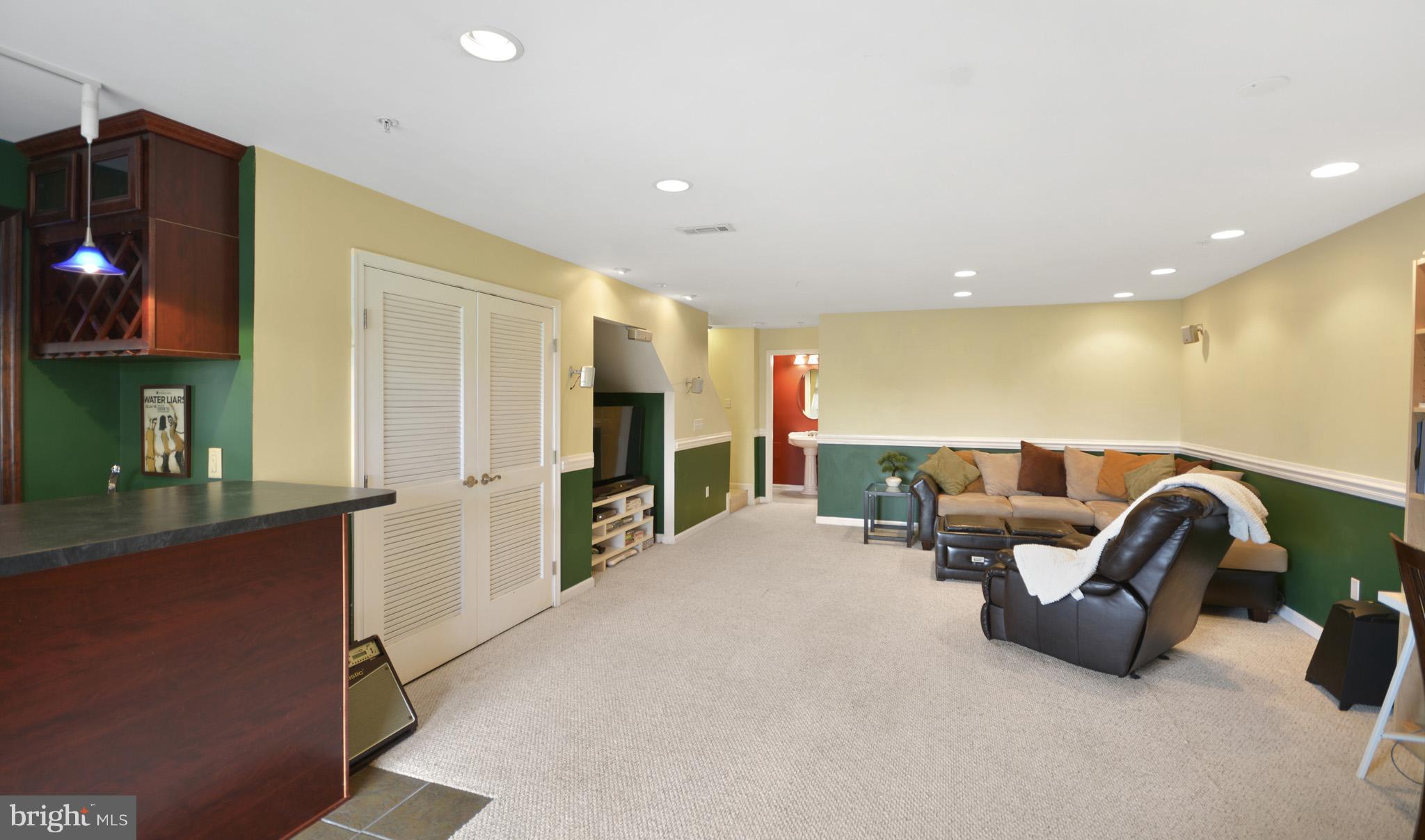 1741 Trestle Street Mount Airy, MD 21771 - Photo 22 of 30 a living room with furniture and a flat screen tv