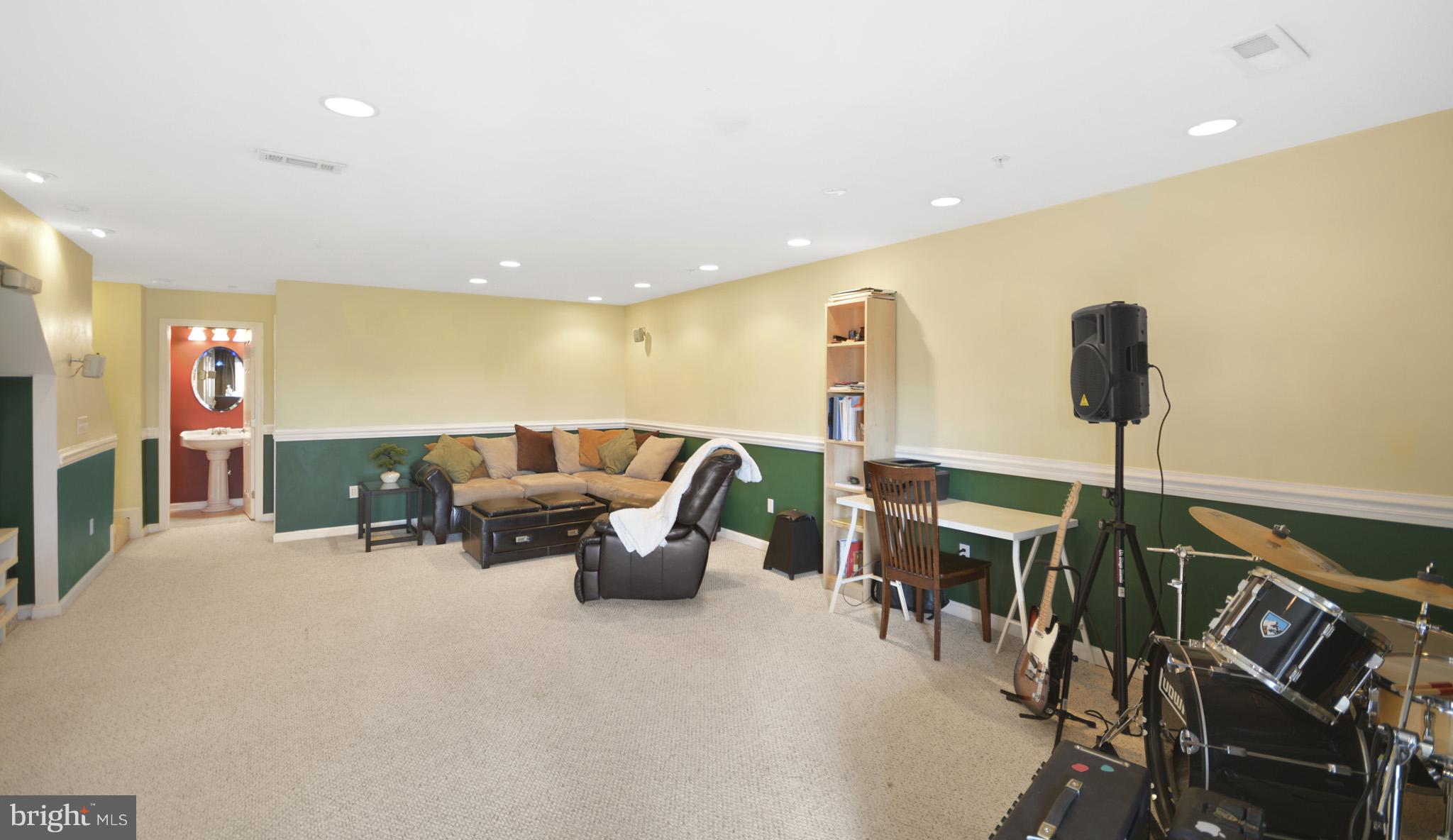 1741 Trestle Street Mount Airy, MD 21771 - Photo 23 of 30 a living room with furniture and a flat screen tv