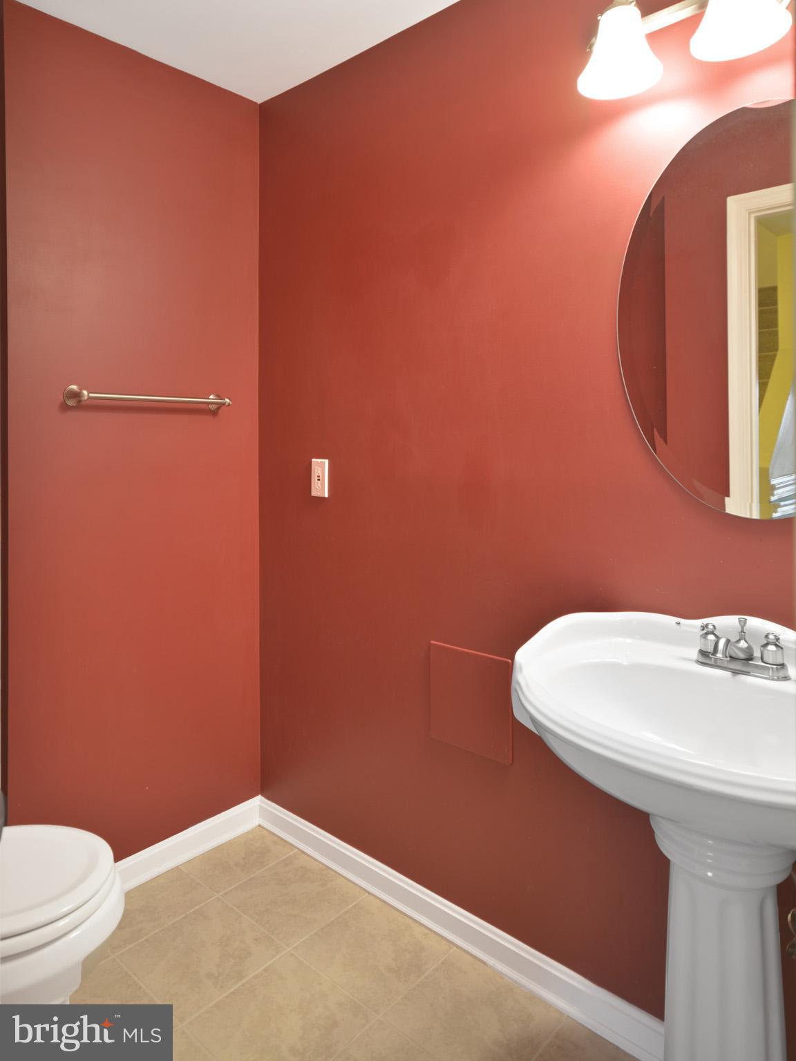 1741 Trestle Street Mount Airy, MD 21771 - Photo 29 of 30 a bathroom with a sink a toilet and mirror