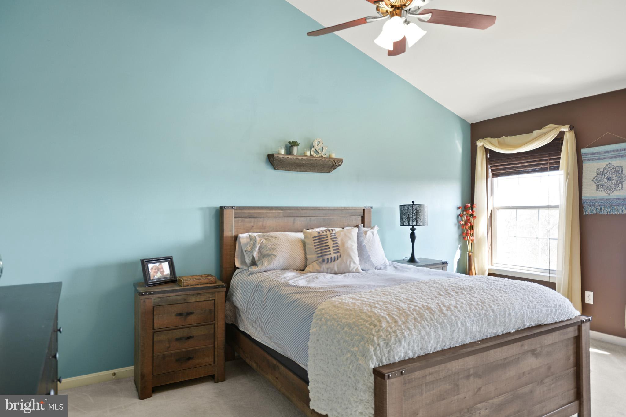 1741 Trestle Street Mount Airy, MD 21771 - Photo 6 of 30 a bedroom with a bed and a chandelier