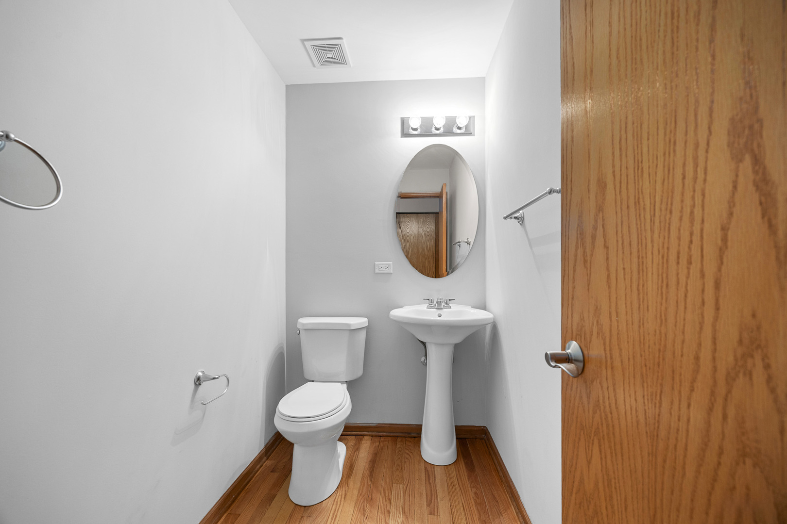 1301 Bridgehampton Drive Plainfield, IL 60586 - Photo 15 of 34 a bathroom with a toilet sink a mirror and vanity