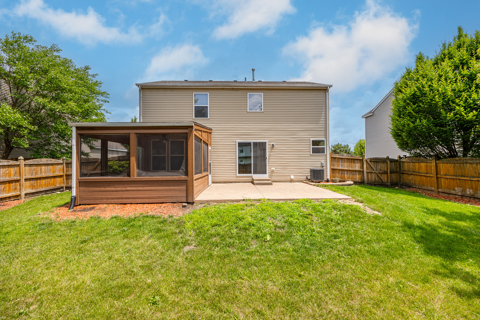 1301 Bridgehampton Drive Plainfield, IL 60586 - Photo 33 of 34 a view of a house with backyard and a tree