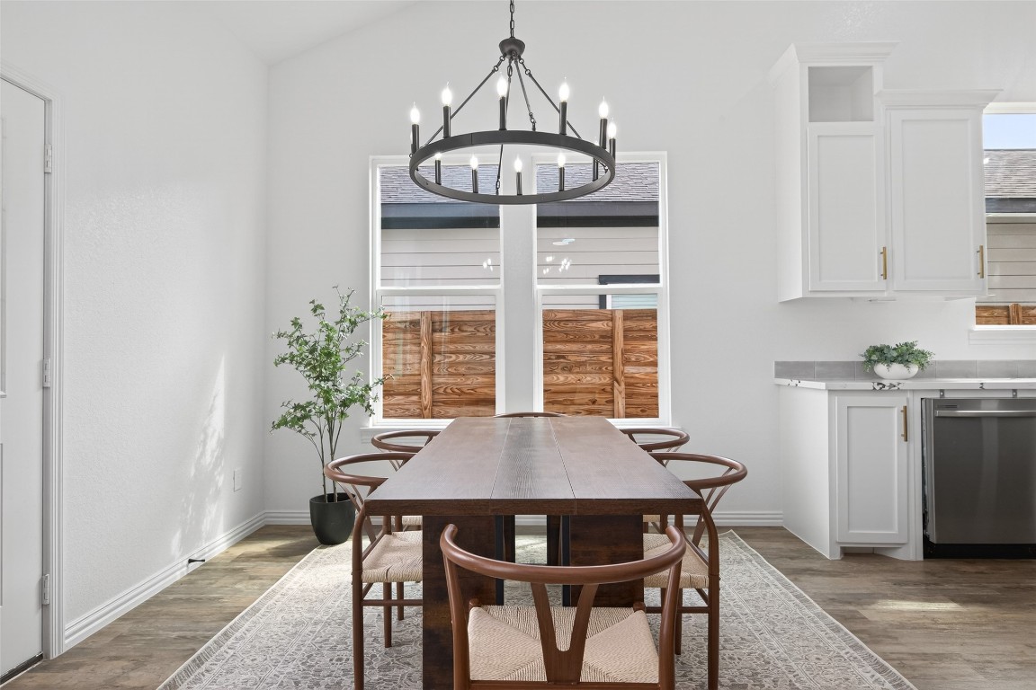 1105 Peter Pne Street Huffman, TX 77336 - Photo 19 of 41 a view of a dining room with furniture and chandelier