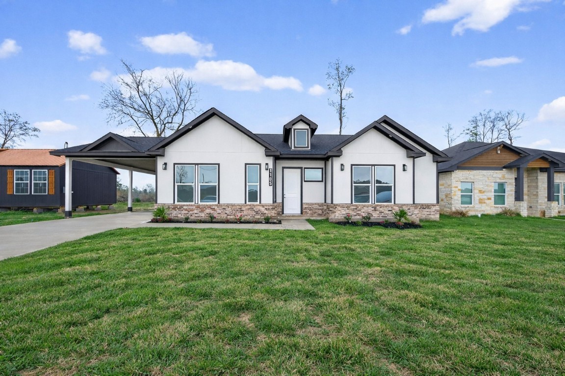 1105 Peter Pne Street Huffman, TX 77336 - Photo 2 of 41 a front view of a house with a garden