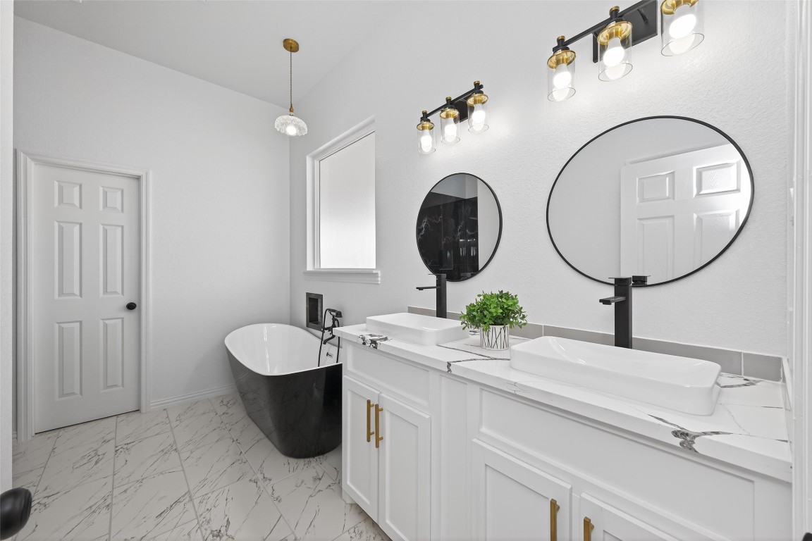 1105 Peter Pne Street Huffman, TX 77336 - Photo 24 of 41 a bathroom with a sink and a mirror