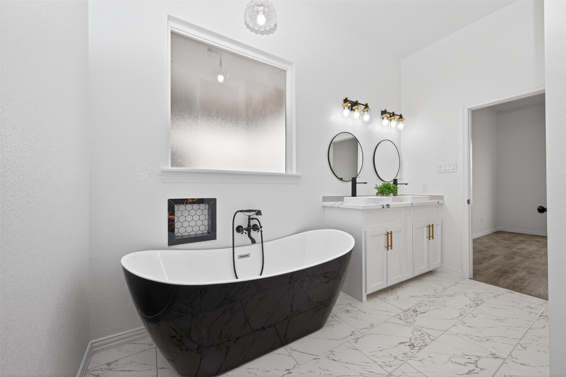1105 Peter Pne Street Huffman, TX 77336 - Photo 25 of 41 a bathroom with a bathtub and a sink