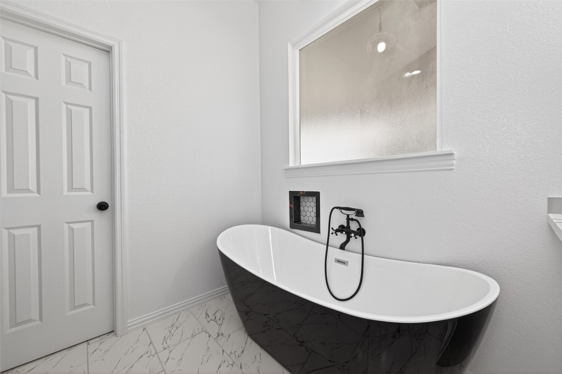 1105 Peter Pne Street Huffman, TX 77336 - Photo 27 of 41 a bathroom with a sink a toilet and mirror