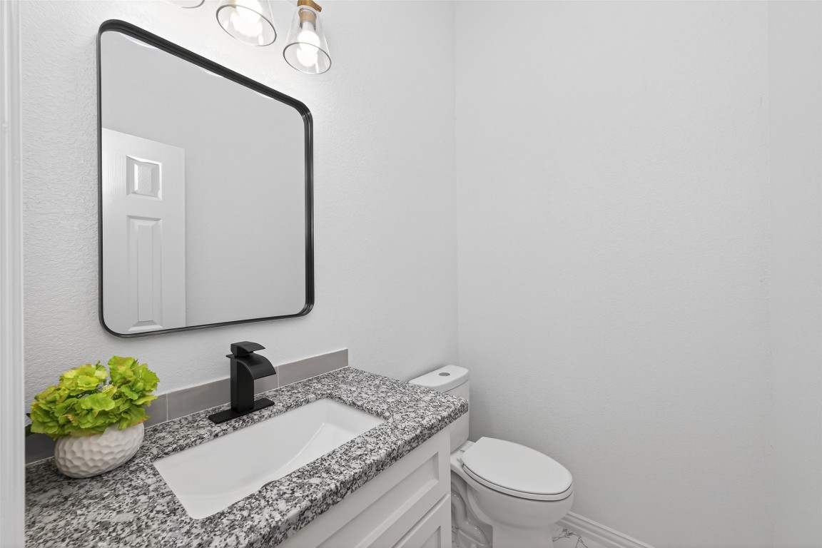1105 Peter Pne Street Huffman, TX 77336 - Photo 35 of 41 a bathroom with a granite countertop sink and a mirror