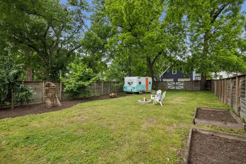 a backyard of a house with swing and slide