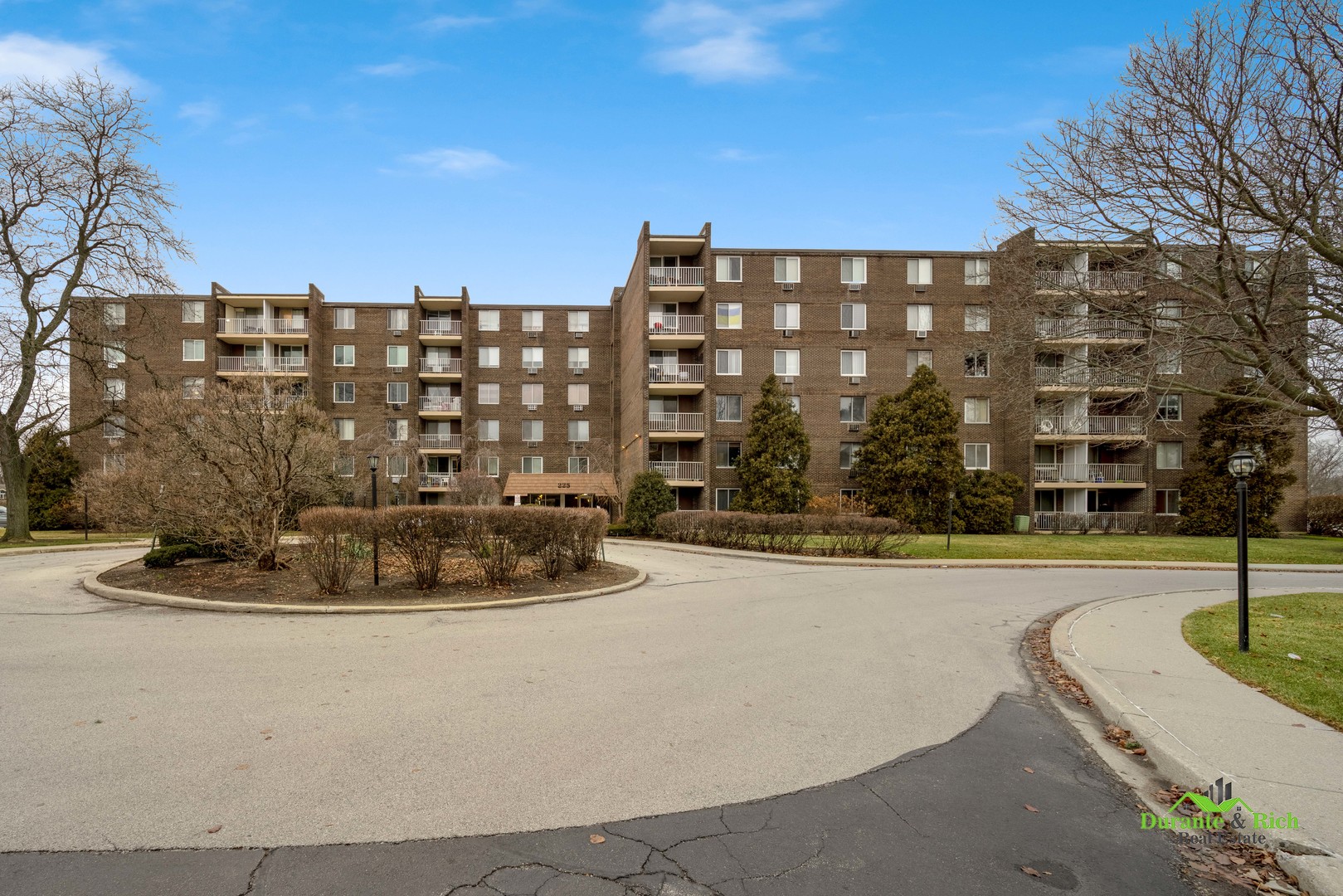 225 South Rohlwing Road, Unit 118 Palatine, IL 60074 - Photo 2 of 12 a view of building with yard and swimming pool