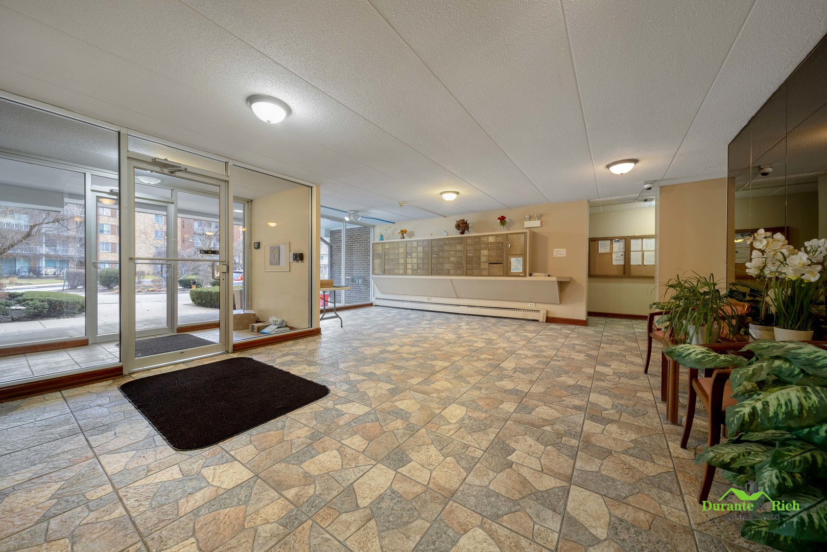 225 South Rohlwing Road, Unit 118 Palatine, IL 60074 - Photo 3 of 12 a large bathroom with a large tub and shower