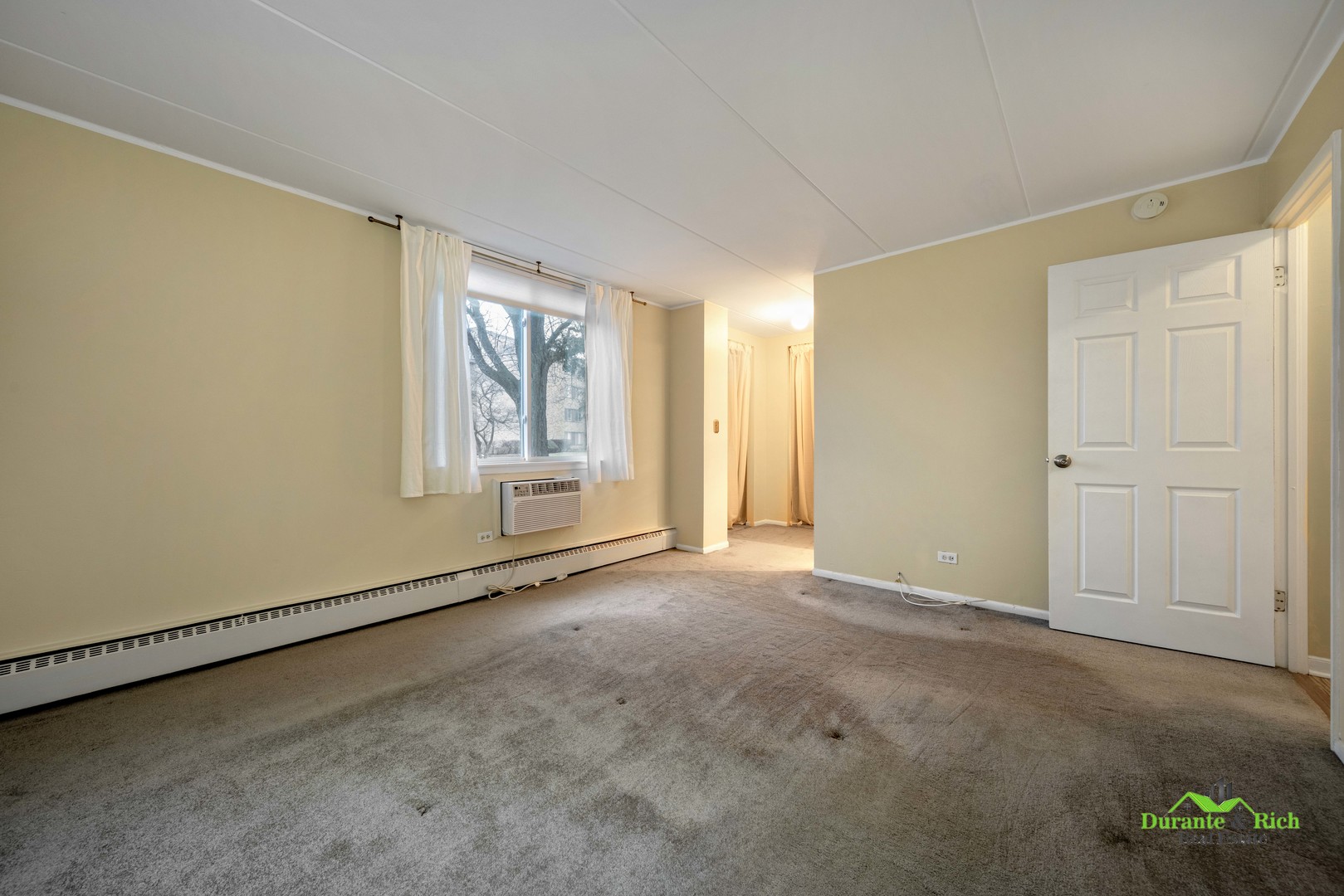 225 South Rohlwing Road, Unit 118 Palatine, IL 60074 - Photo 9 of 12 an empty room with windows