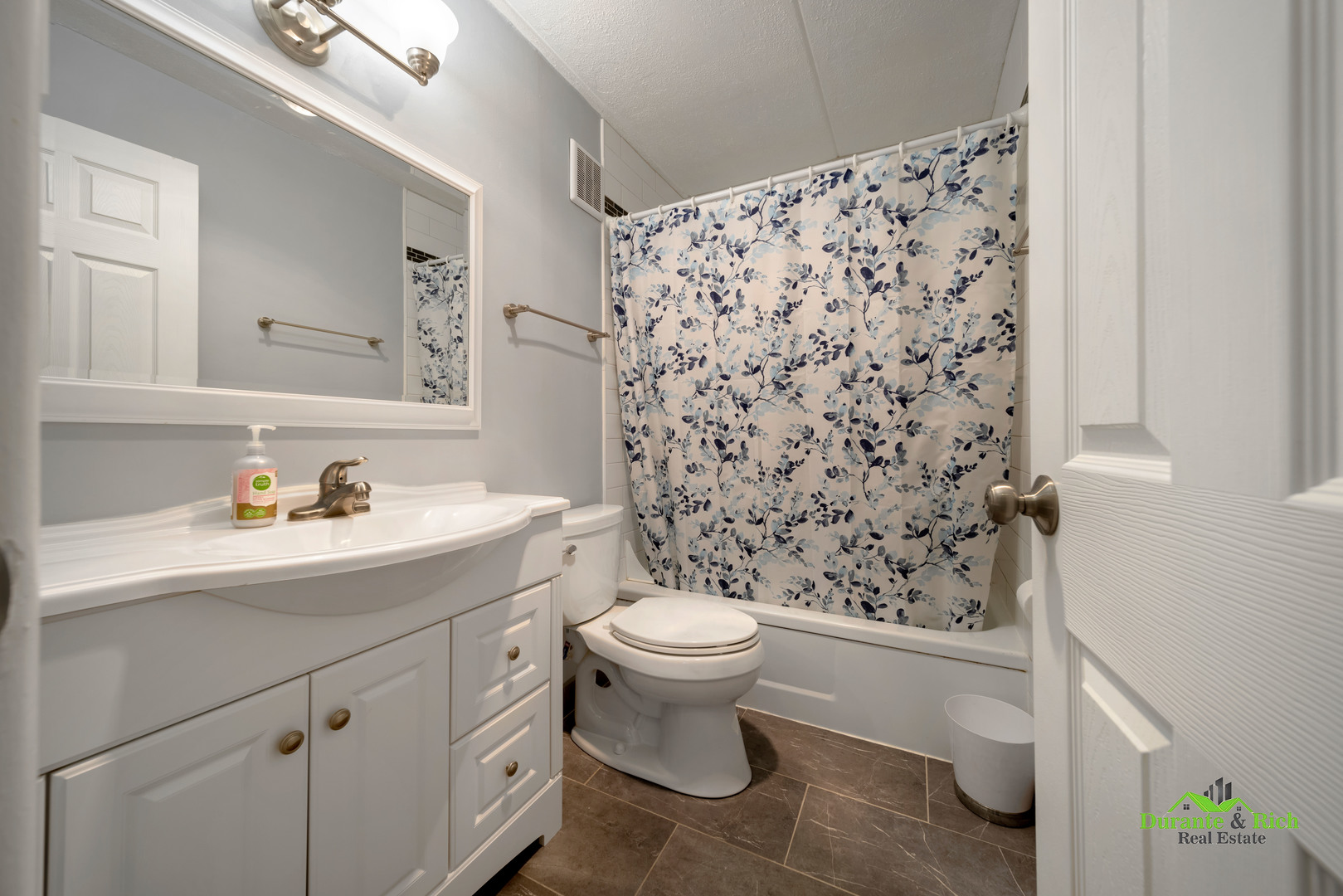 225 South Rohlwing Road, Unit 118 Palatine, IL 60074 - Photo 10 of 12 a bathroom with a sink toilet and a shower