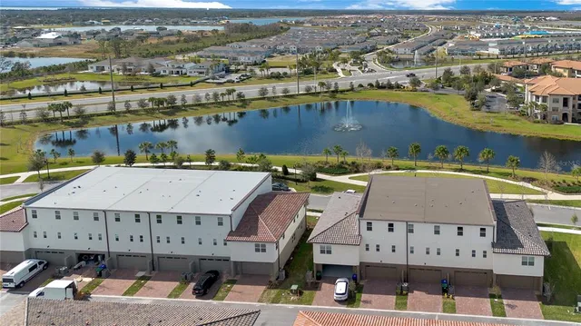 an aerial view of a house with a swimming pool