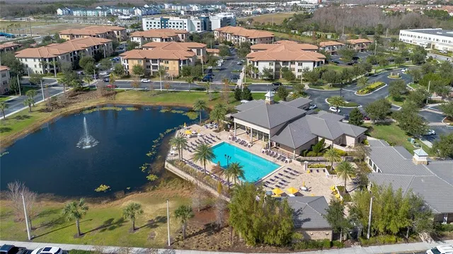 an aerial view of a house with a swimming pool yard and outdoor seating