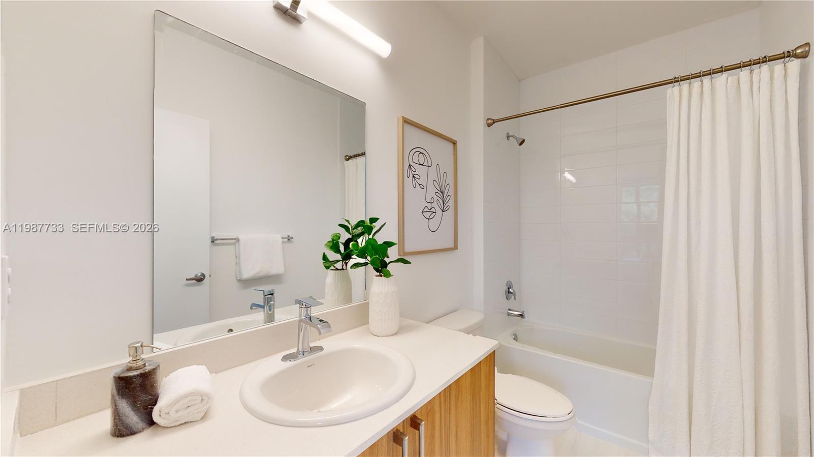 24705 Southwest 129th Avenue, Unit 108 Homestead, FL 33032 - Photo 18 of 33 a bathroom with a sink toilet and shower