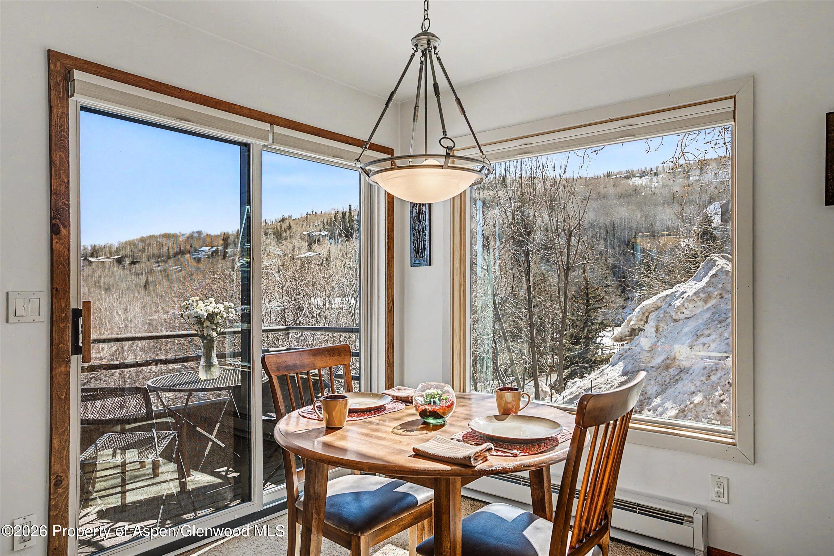34 Lower Woodbridge Road, Unit 149 Snowmass Village, CO 81615 - Photo 5 of 15 a view of a dining room with furniture window and outside view
