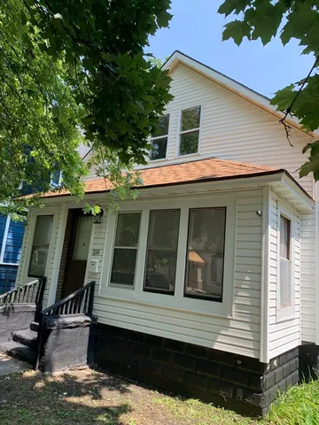 a view of house that has a small window