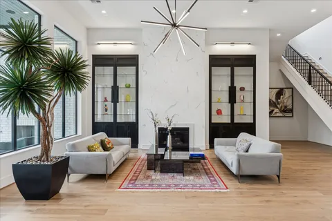 a living room with furniture and kitchen view