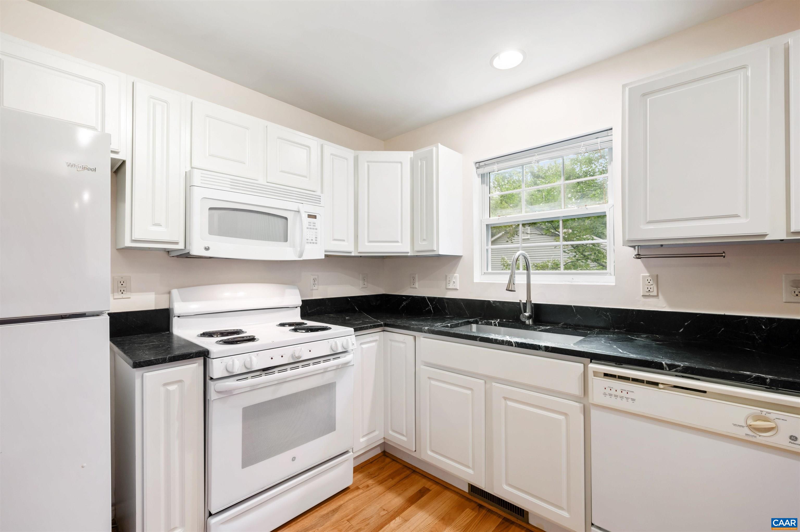 24 Xebec Road Palmyra, VA 22963 - Photo 14 of 41 a kitchen with granite countertop white cabinets and white appliances
