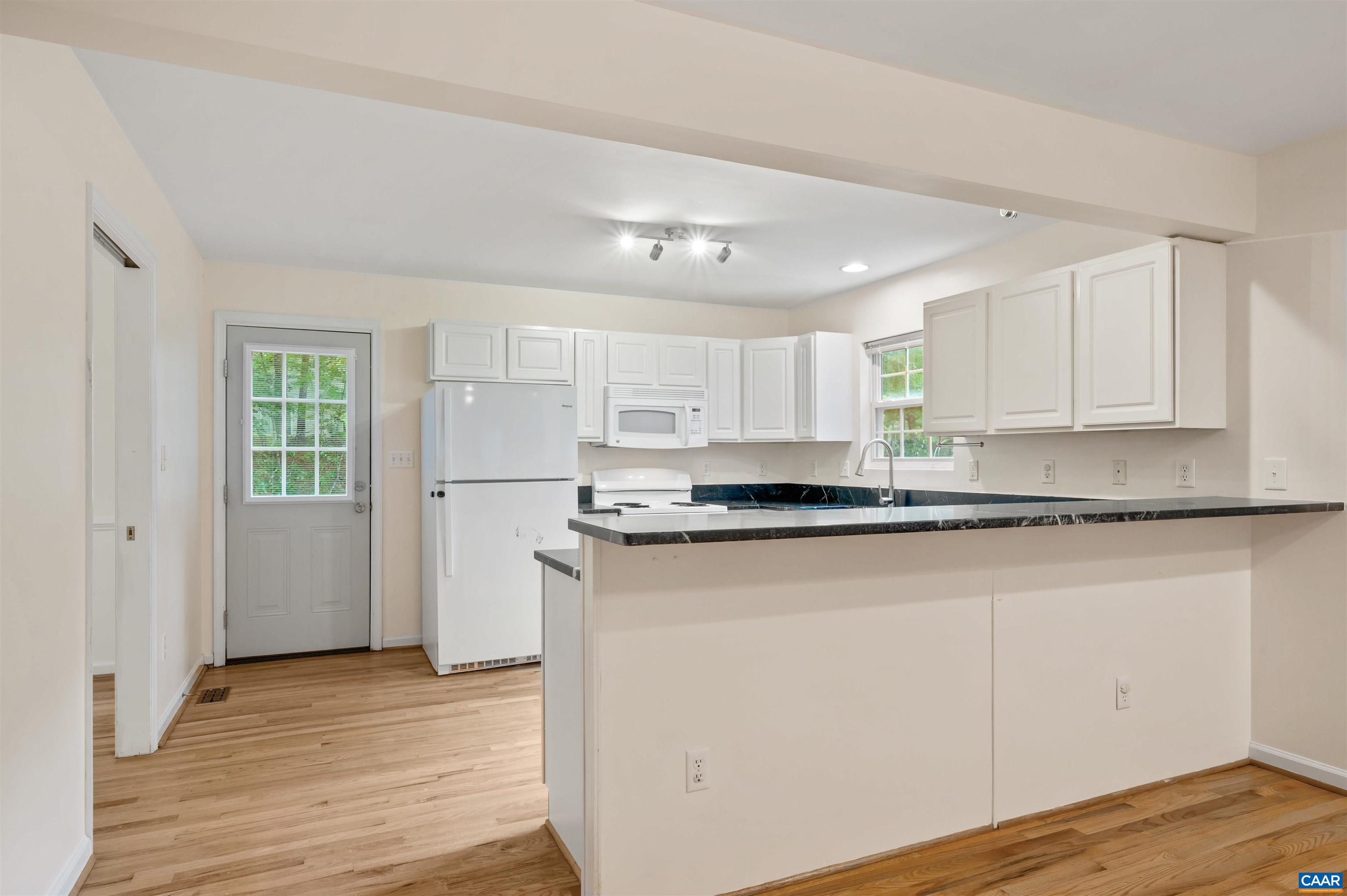 24 Xebec Road Palmyra, VA 22963 - Photo 10 of 41 a kitchen with stainless steel appliances granite countertop a refrigerator a sink and white cabinets