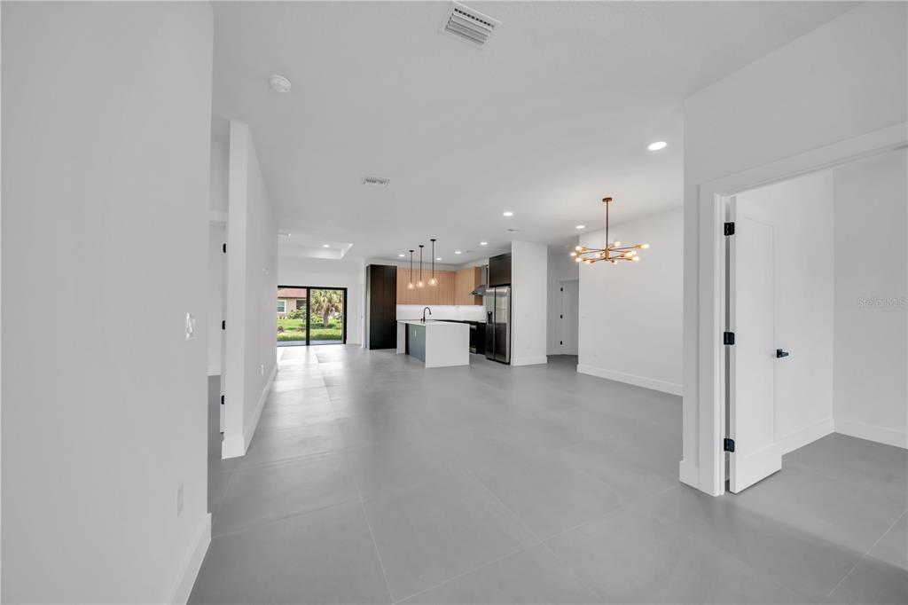 2328 Irondale Road North Port, FL 34287 - Photo 7 of 45 a view of a hallway with a kitchen