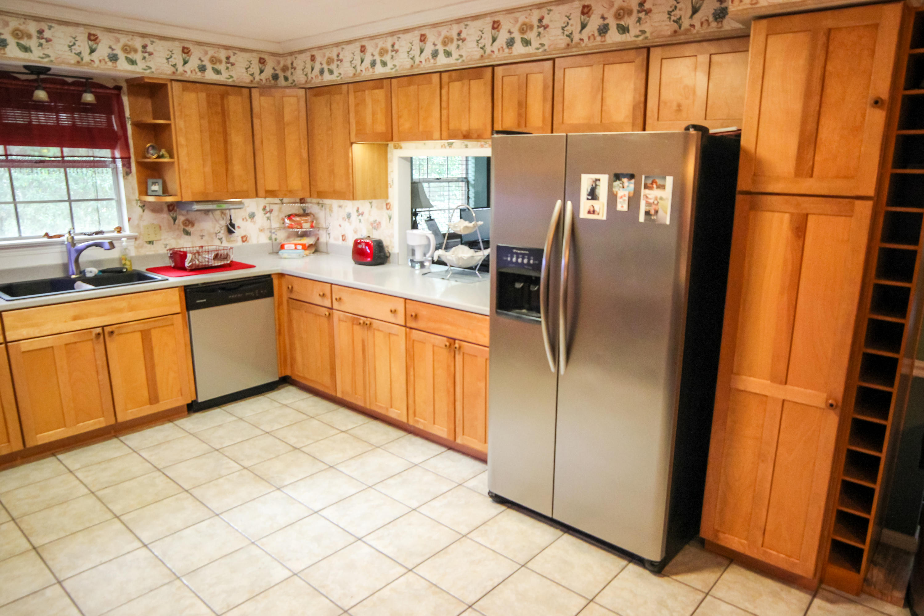 32 Country Club Road Shalimar, FL 32579 - Photo 15 of 56 a kitchen with stainless steel appliances a refrigerator sink and cabinets