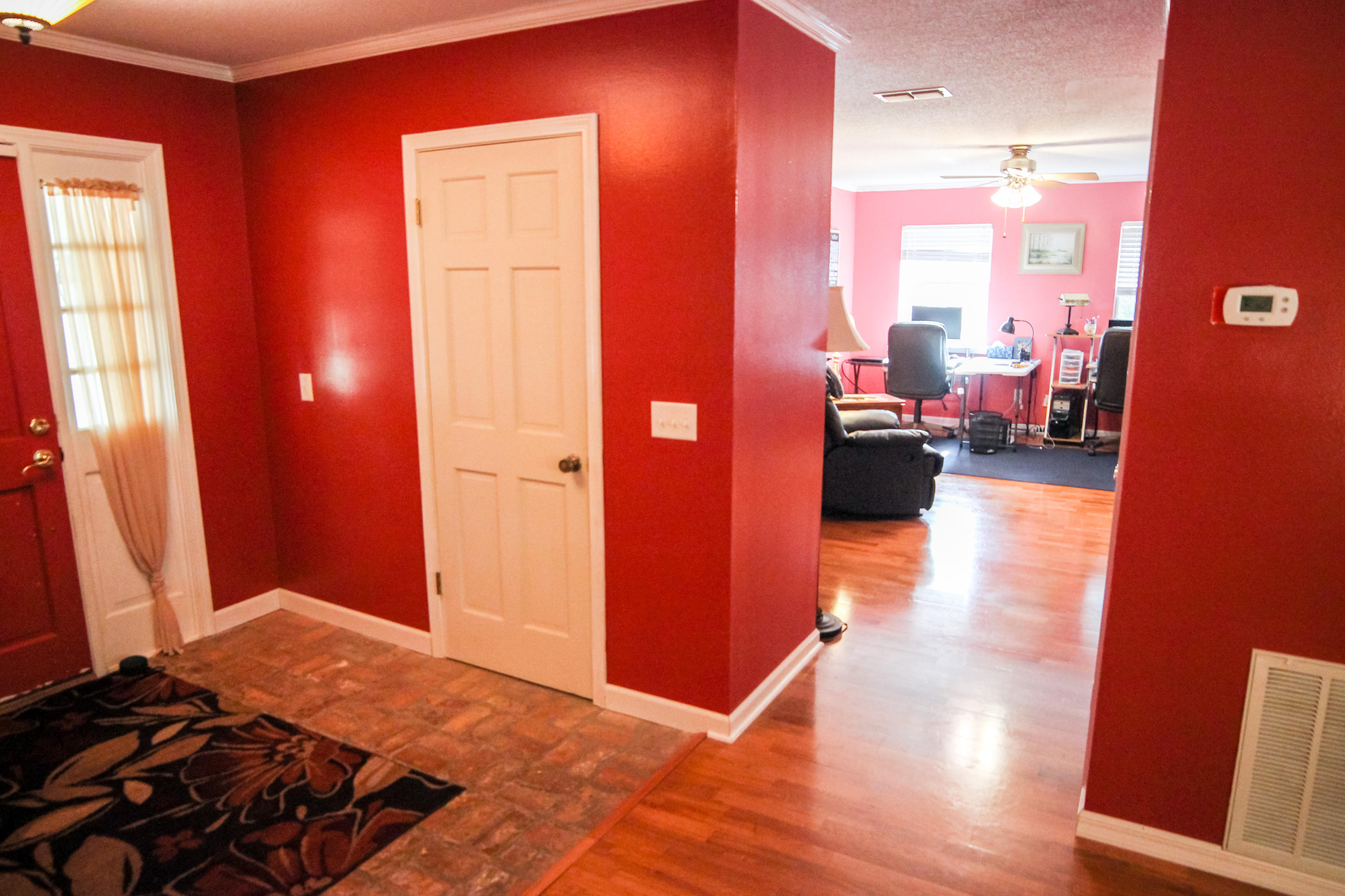 32 Country Club Road Shalimar, FL 32579 - Photo 20 of 56 a bedroom with a bed and wooden floor