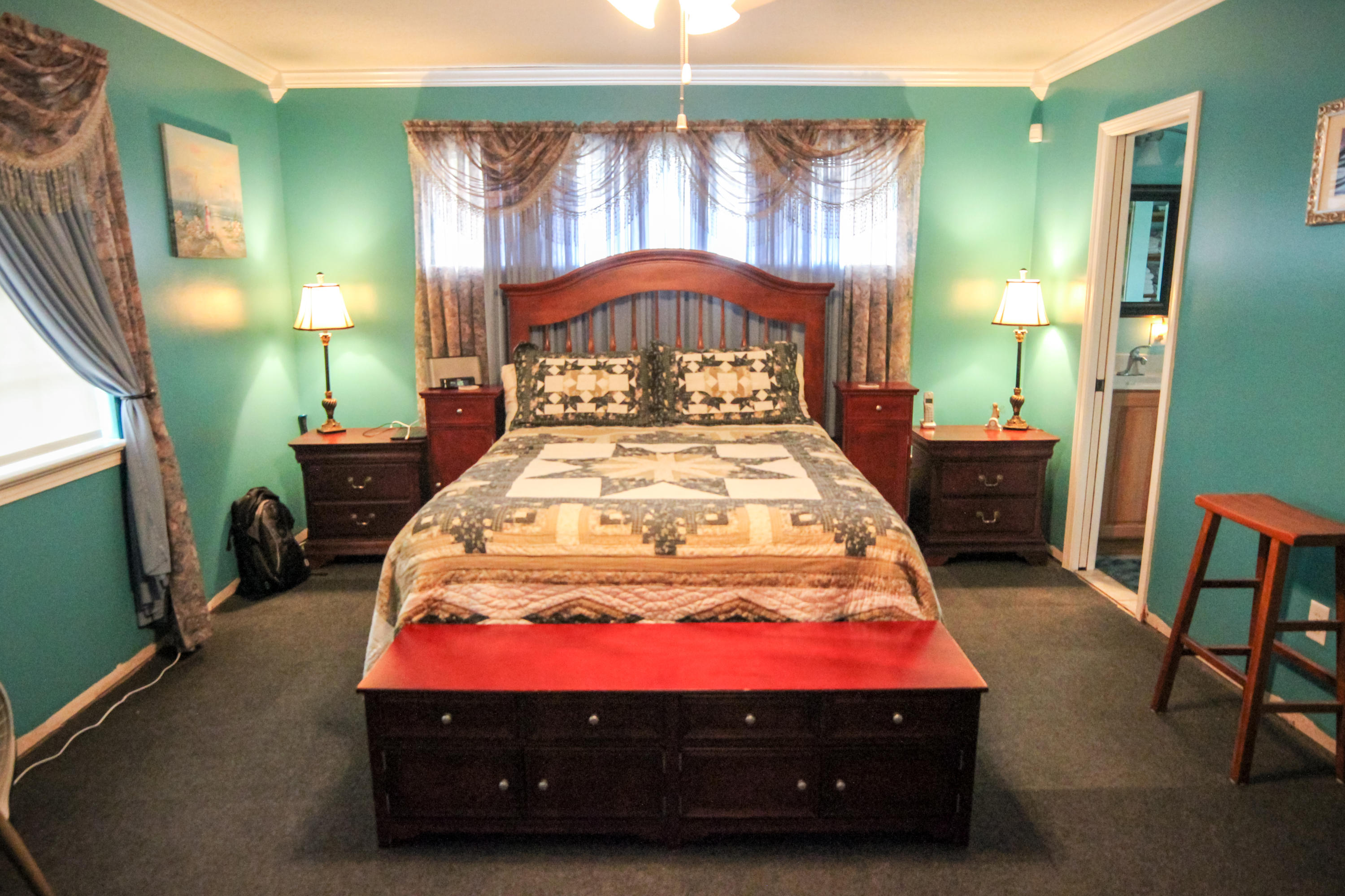 32 Country Club Road Shalimar, FL 32579 - Photo 26 of 56 a bedroom with a bed window and a table in it