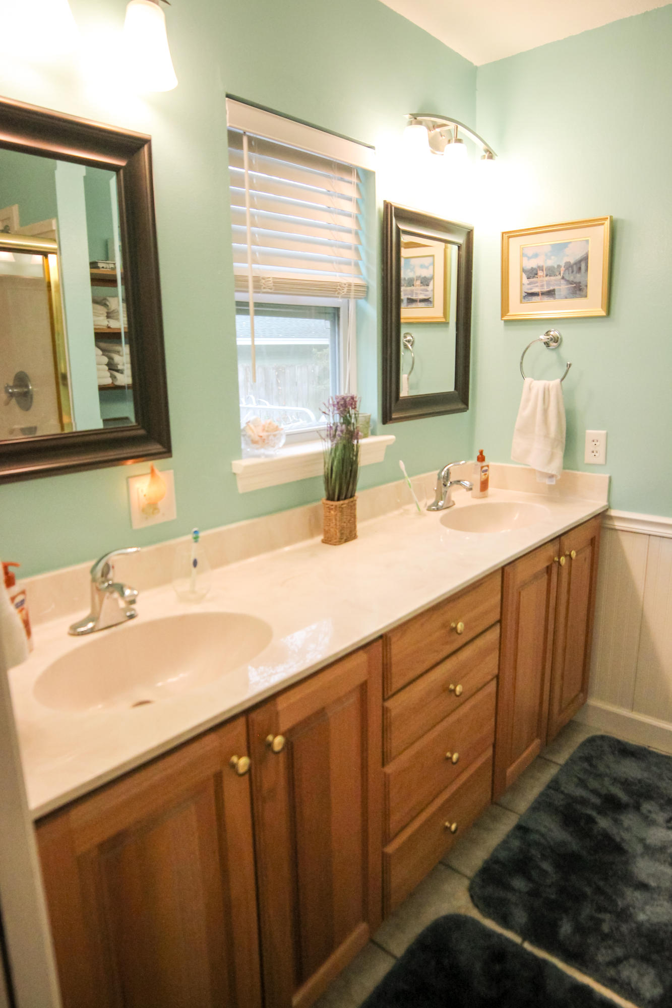 32 Country Club Road Shalimar, FL 32579 - Photo 28 of 56 a bathroom with a double vanity sink and a mirror