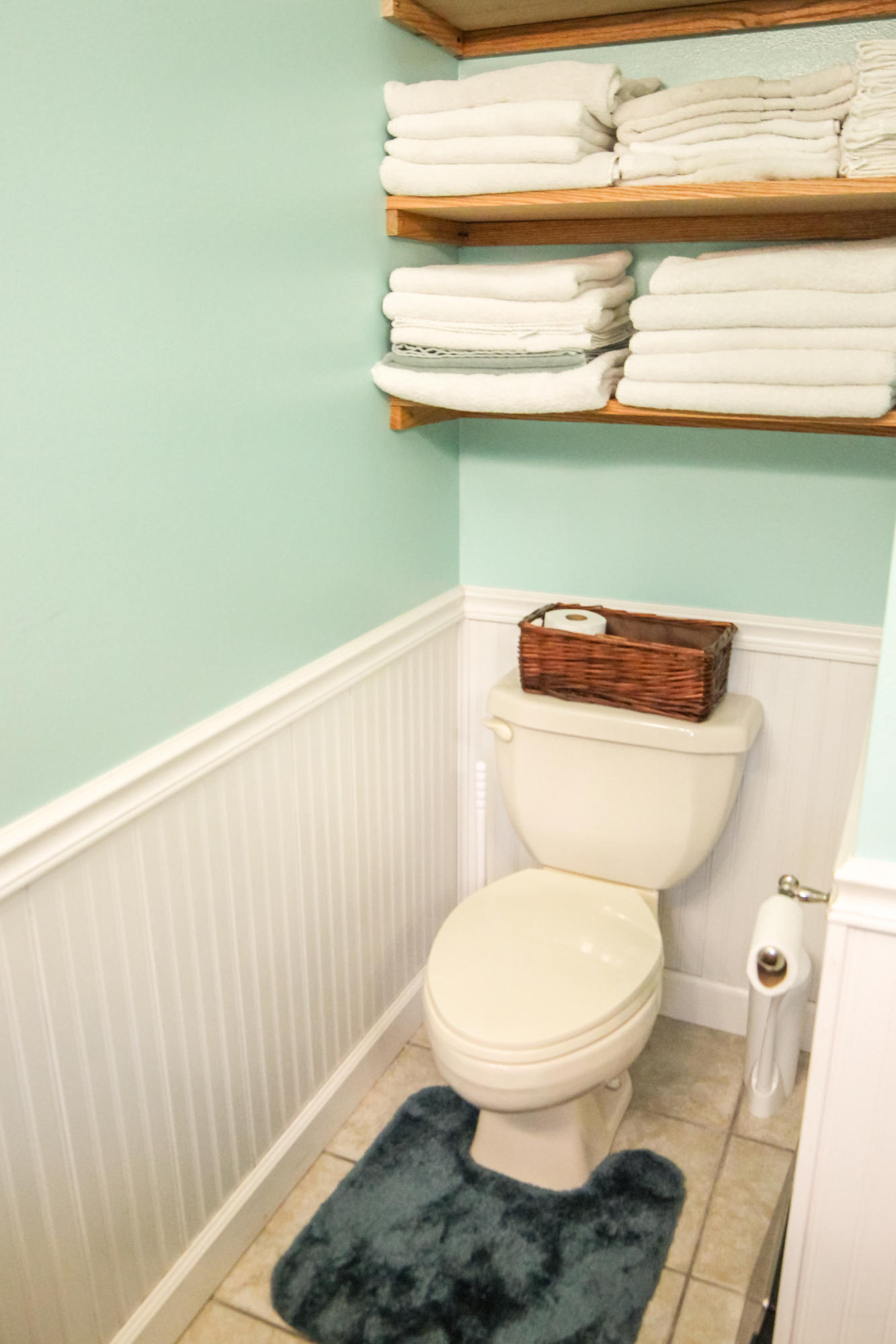 32 Country Club Road Shalimar, FL 32579 - Photo 29 of 56 a white toilet sitting next to a shower curtain