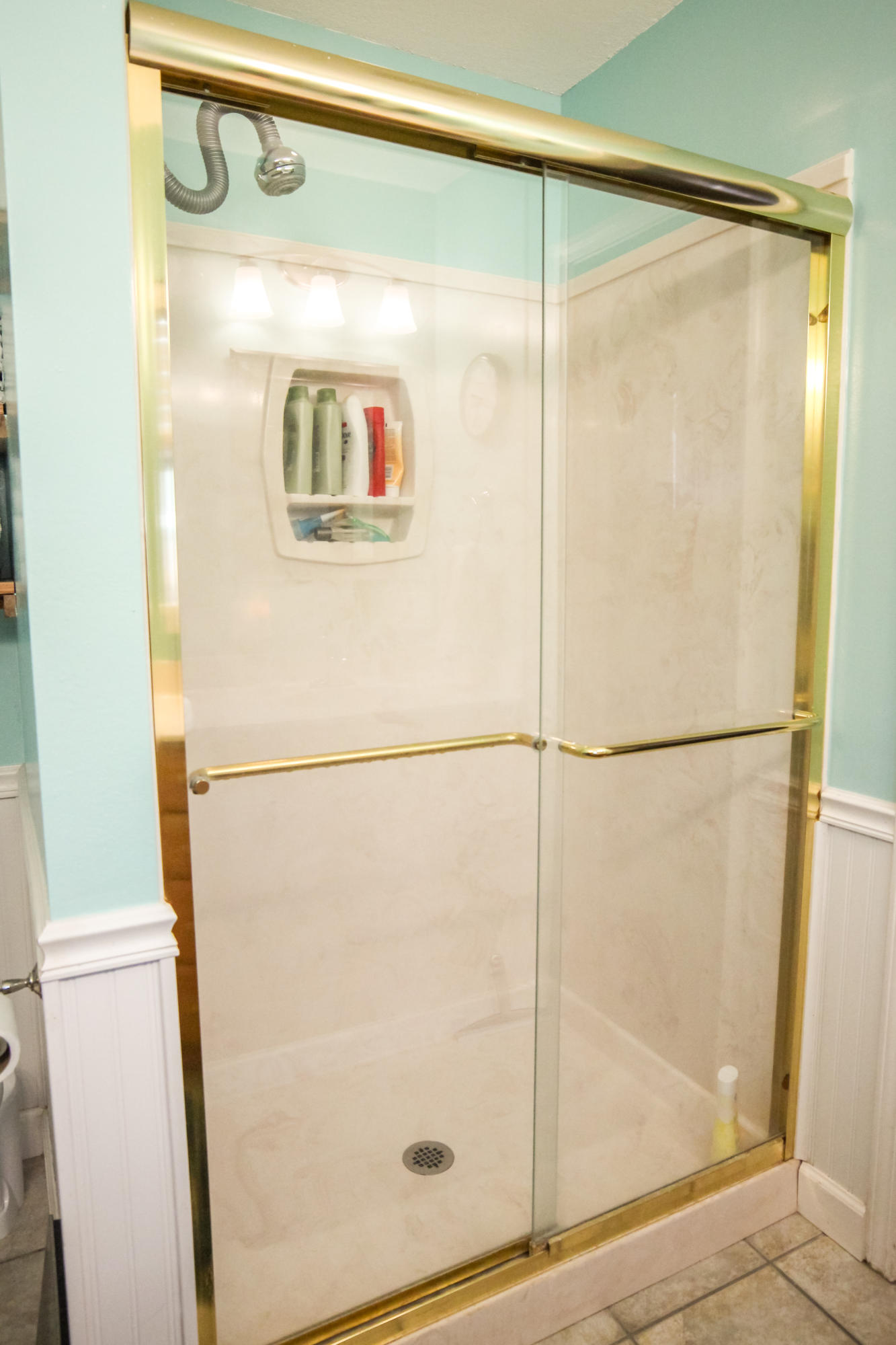 32 Country Club Road Shalimar, FL 32579 - Photo 30 of 56 a bathroom with a glass shower door