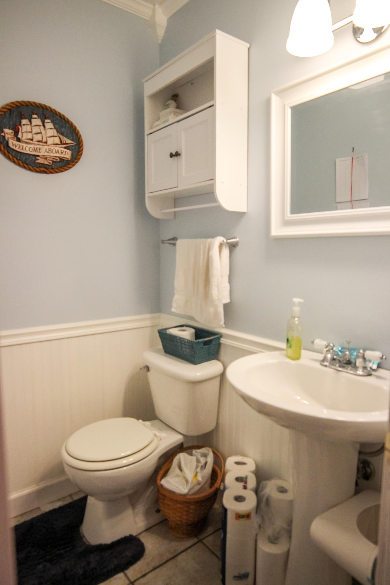 32 Country Club Road Shalimar, FL 32579 - Photo 31 of 56 a bathroom with a sink a toilet and a mirror