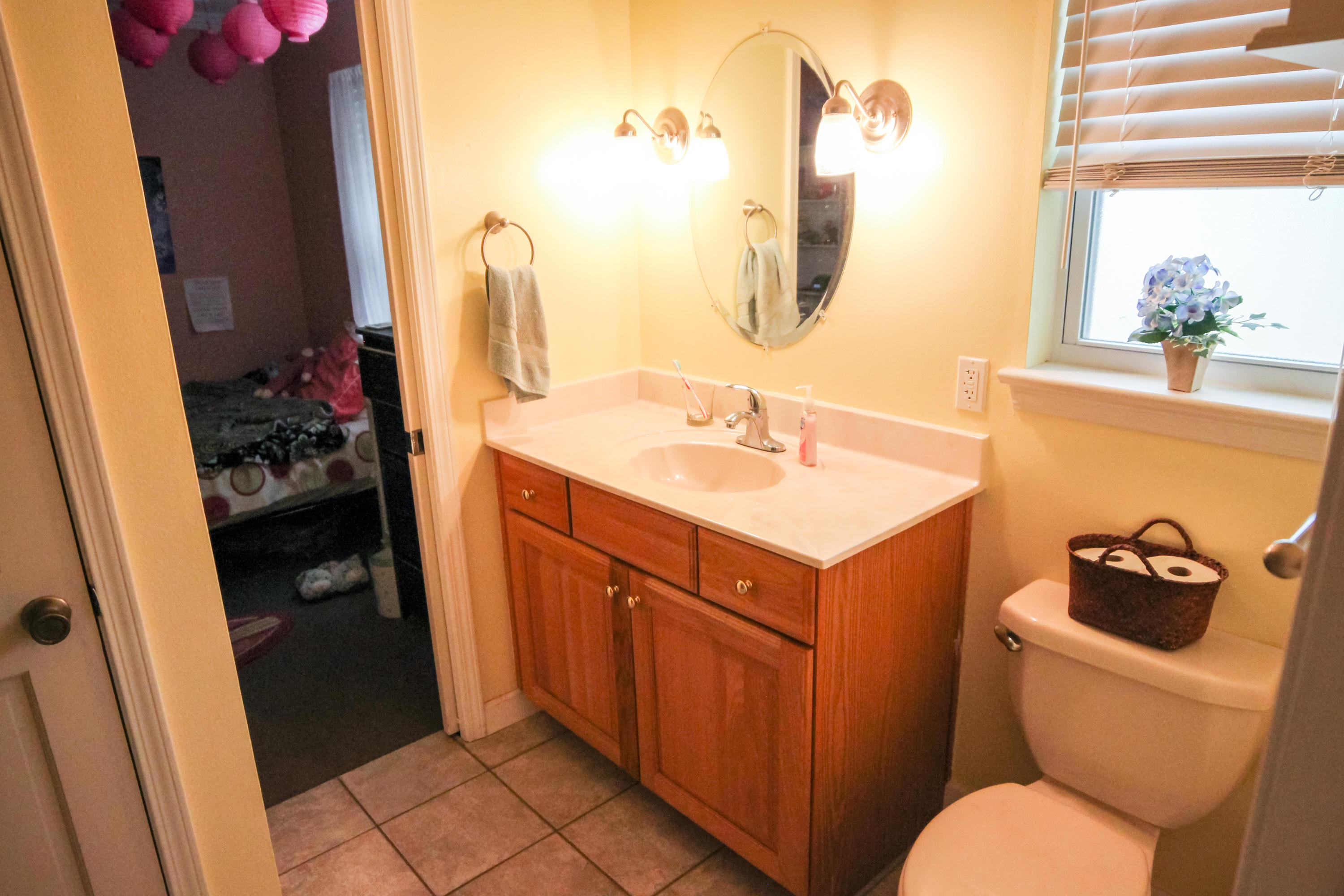 32 Country Club Road Shalimar, FL 32579 - Photo 36 of 56 a bathroom with a sink vanity mirror and toilet