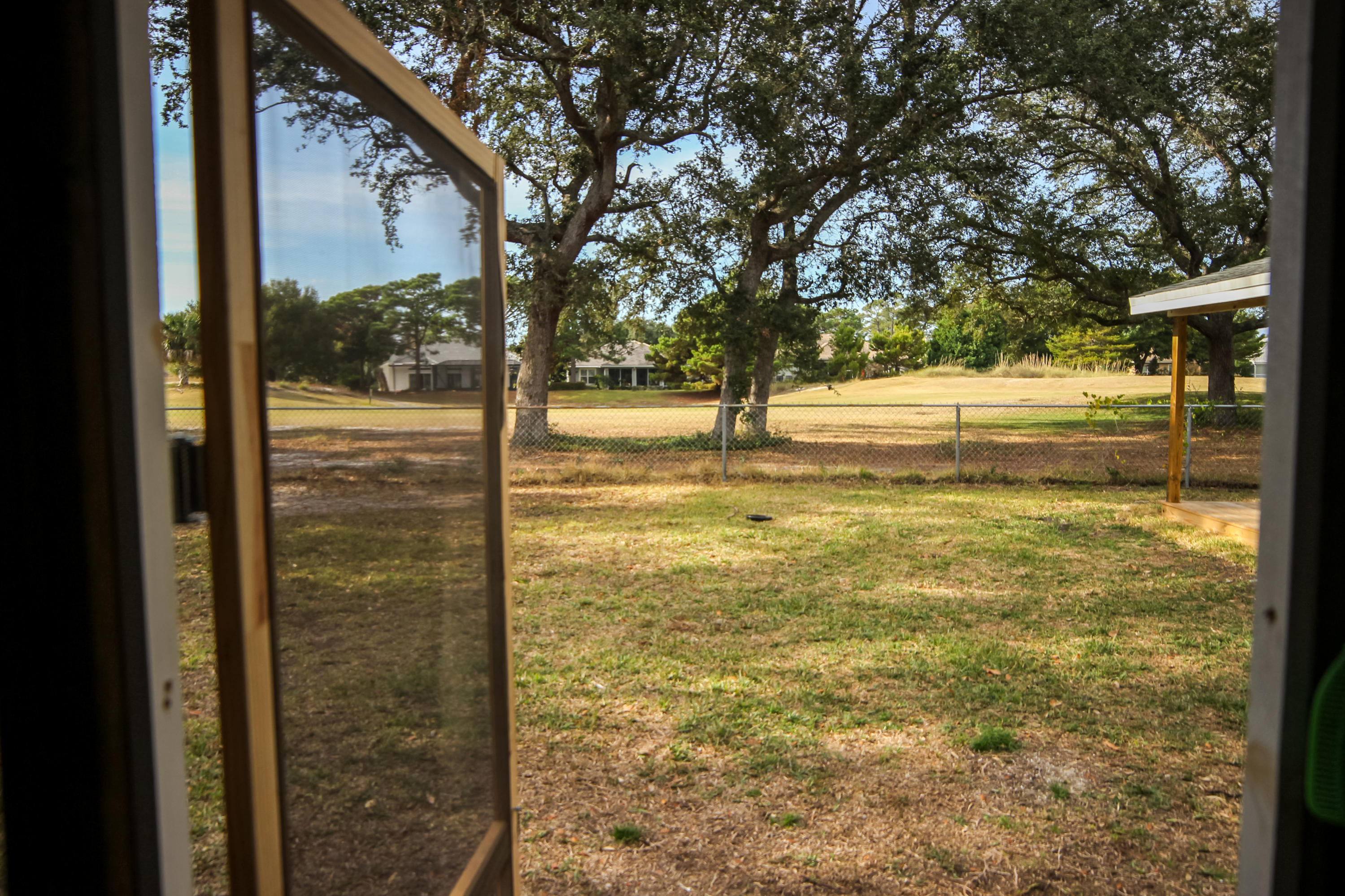 32 Country Club Road Shalimar, FL 32579 - Photo 42 of 56 a view of a large yard with large tree
