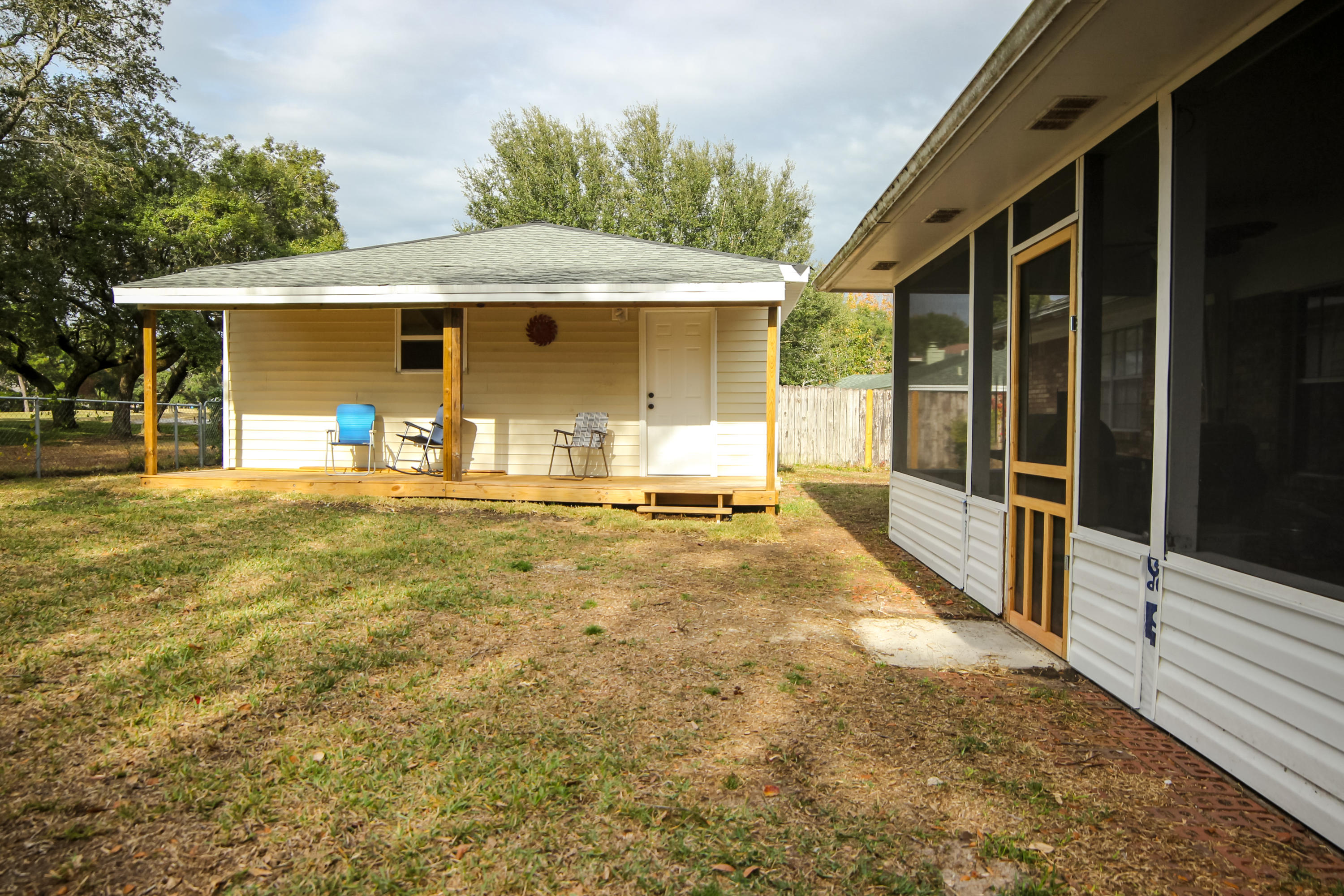 32 Country Club Road Shalimar, FL 32579 - Photo 43 of 56 a front view of a house with a yard