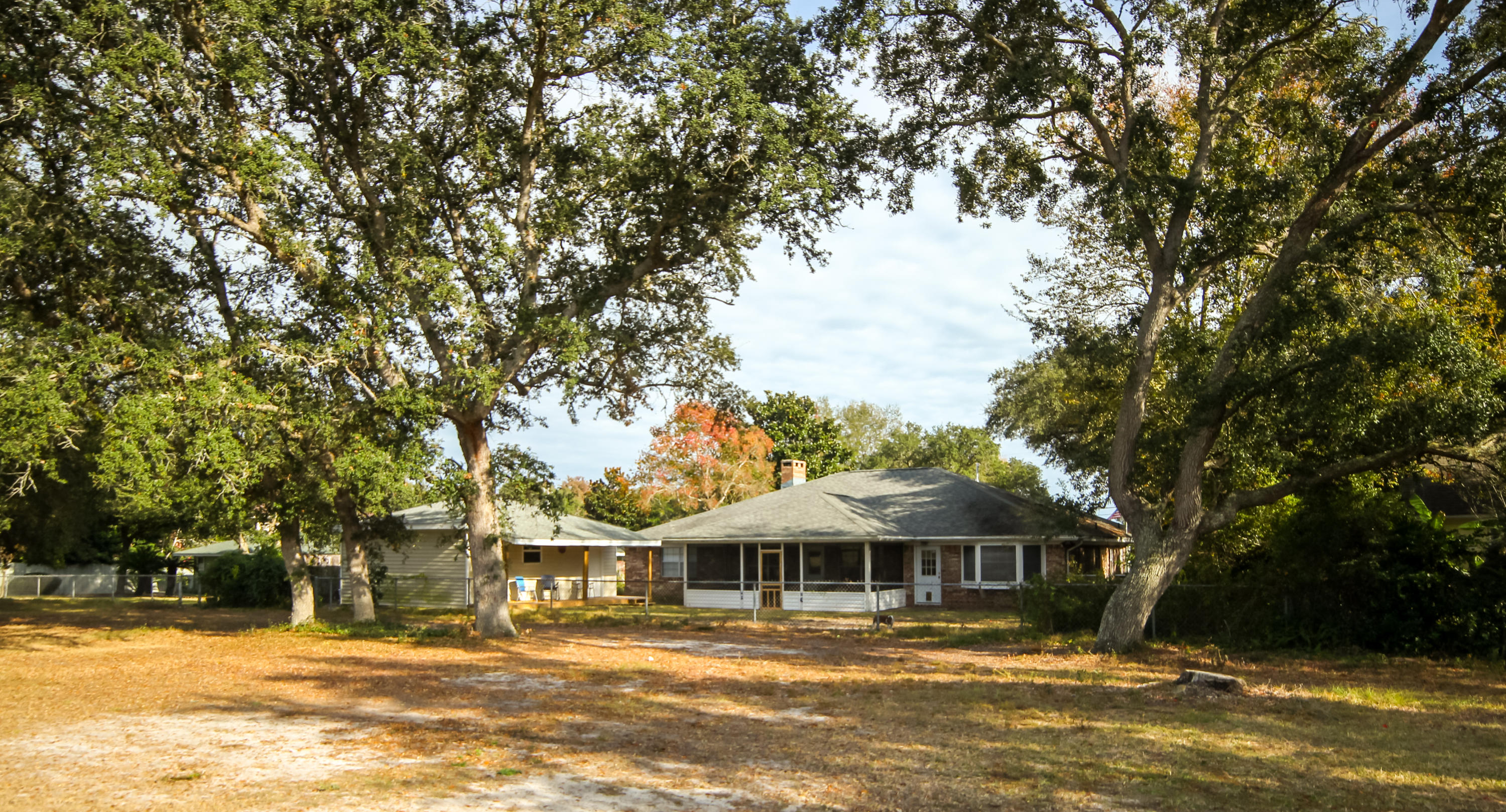 32 Country Club Road Shalimar, FL 32579 - Photo 55 of 56 a front view of a building with a garden