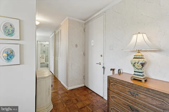 a view of an entryway with wooden floor
