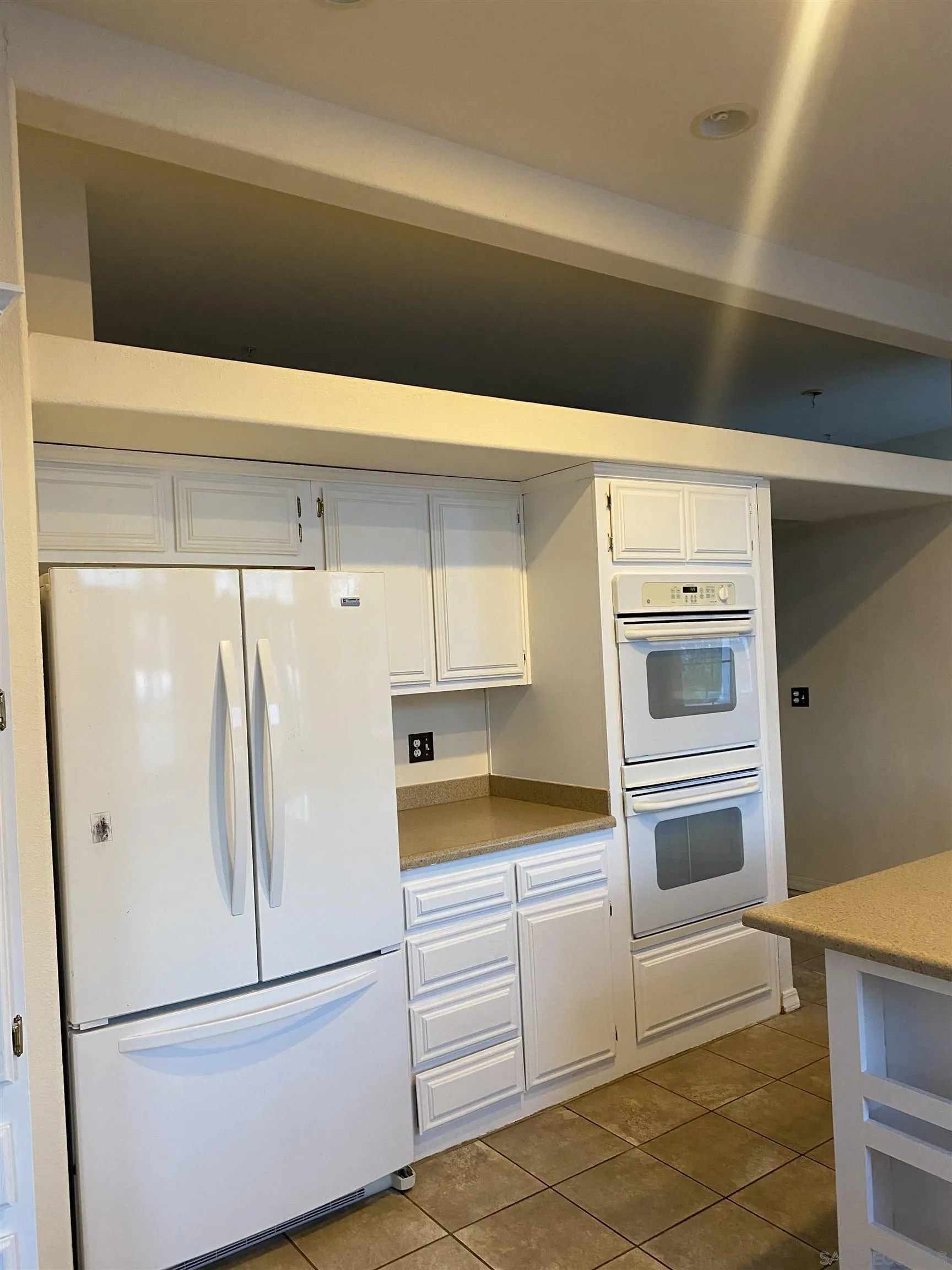 2768 Borrego Springs Road Borrego Springs, CA 92004 - Photo 12 of 55 a white refrigerator freezer and a stove sitting inside of a kitchen