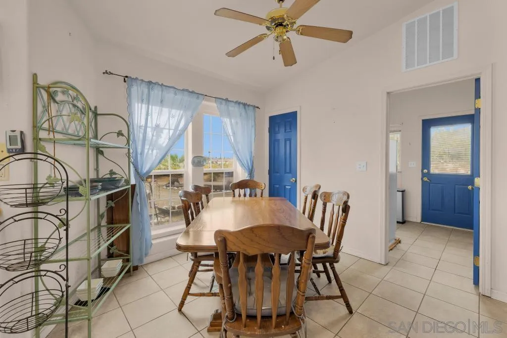 2768 Borrego Springs Road Borrego Springs, CA 92004 - Photo 16 of 55 a view of a dining room with furniture and a chandelier
