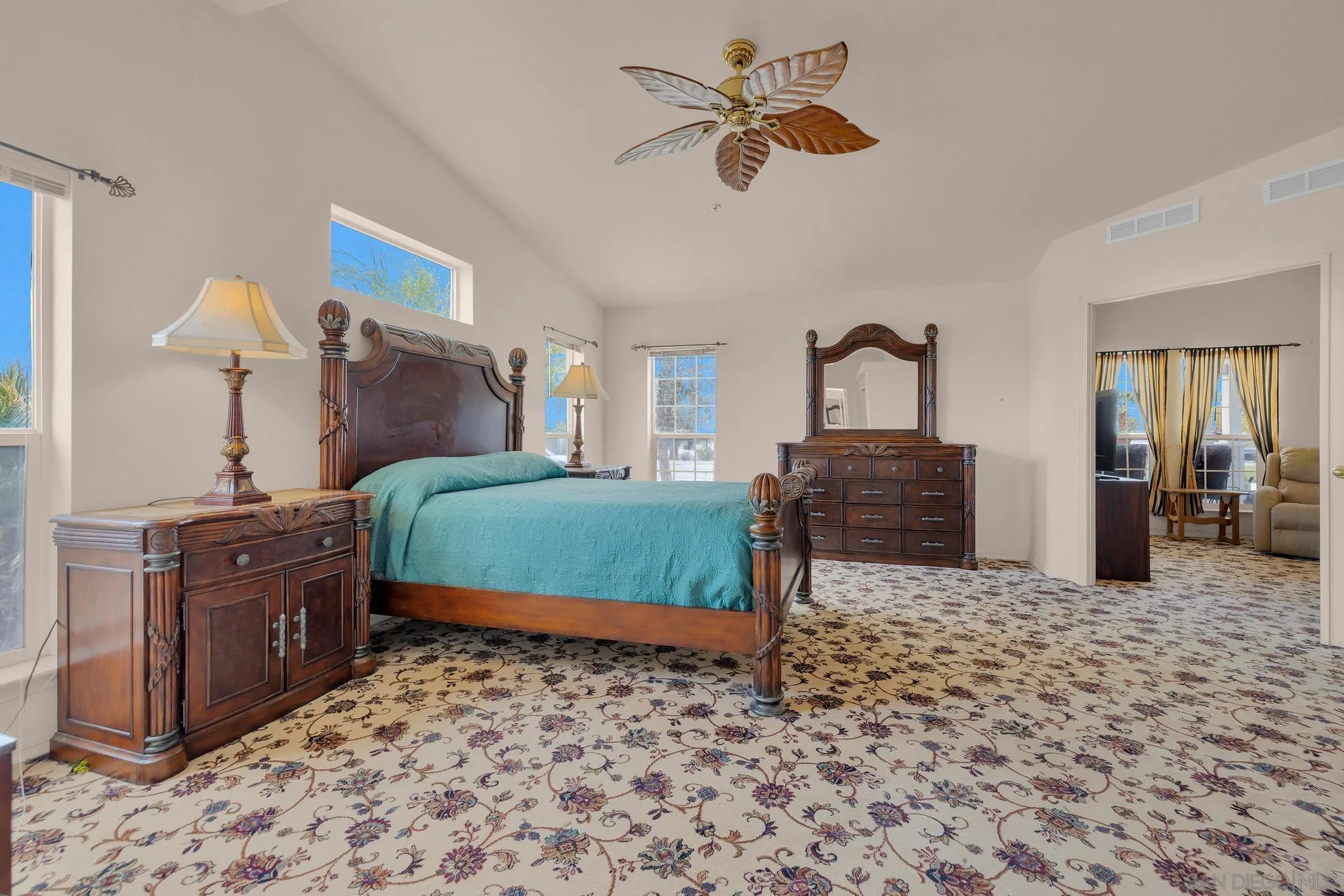 2768 Borrego Springs Road Borrego Springs, CA 92004 - Photo 18 of 55 a bedroom with a bed and a chandelier