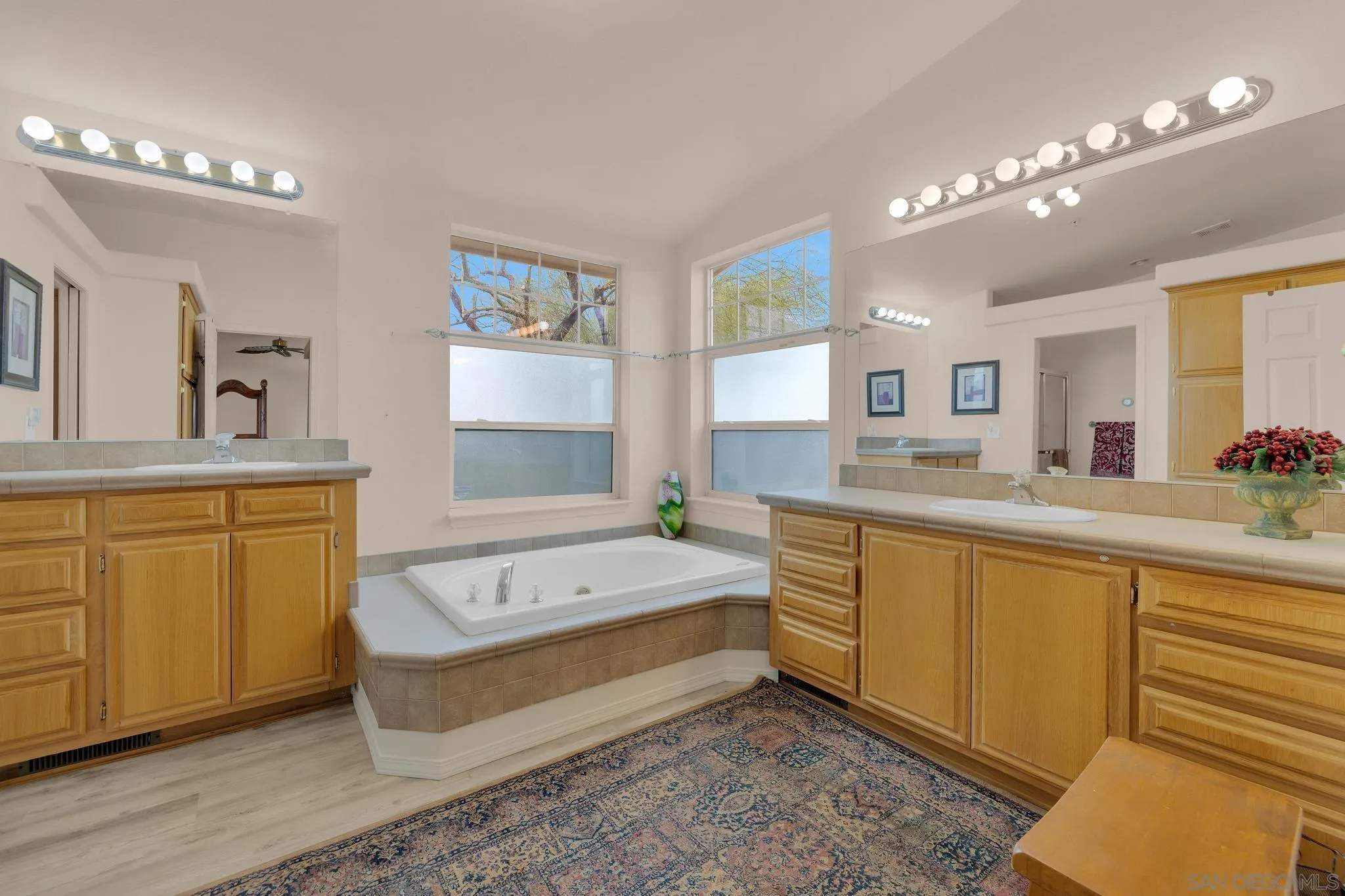 2768 Borrego Springs Road Borrego Springs, CA 92004 - Photo 23 of 55 a spacious bathroom with a double vanity sink a mirror and a bathtub