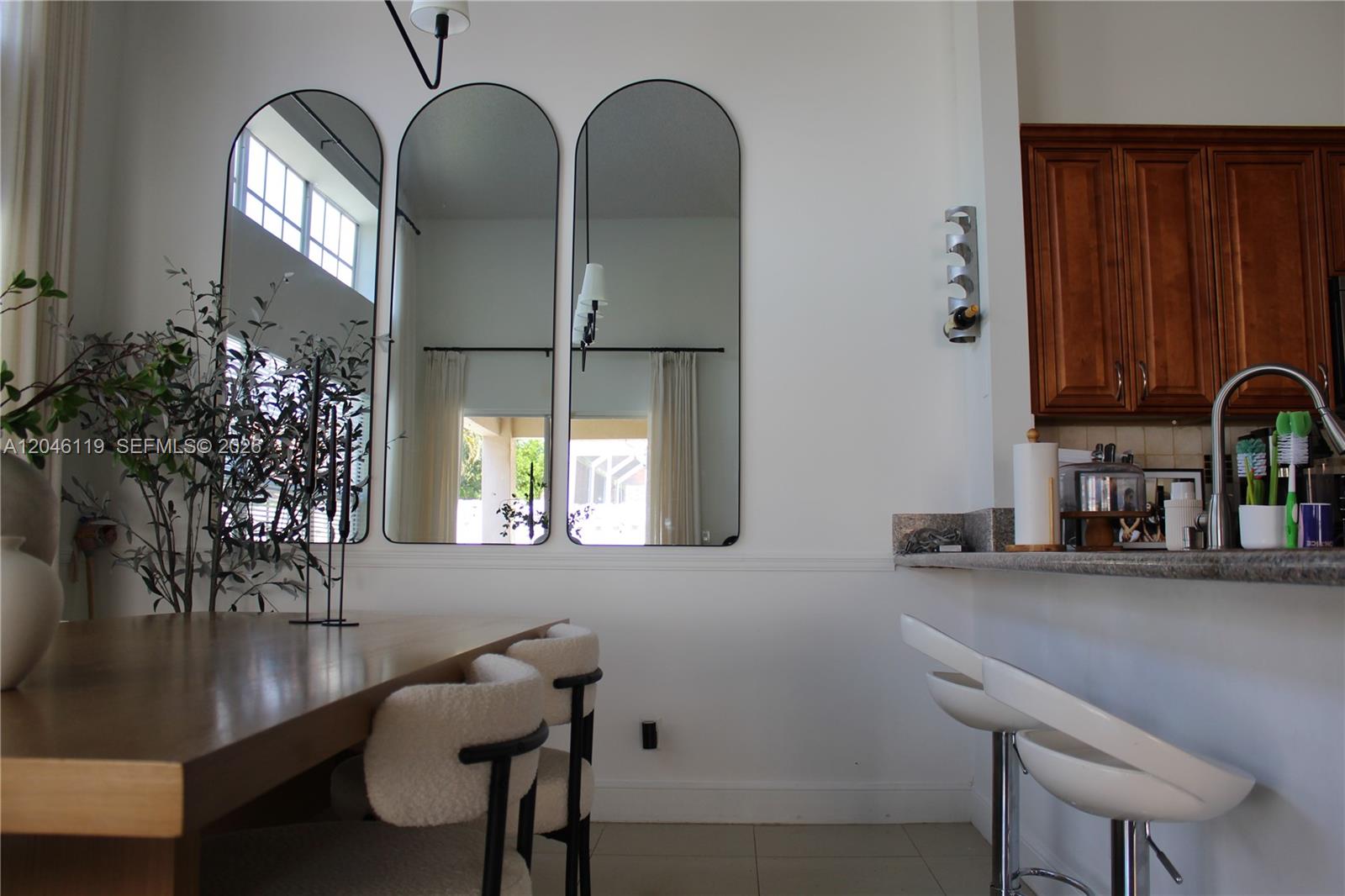 312 Bridgeton Road Weston, FL 33326 - Photo 7 of 13 a view of a dining room with furniture and chandelier