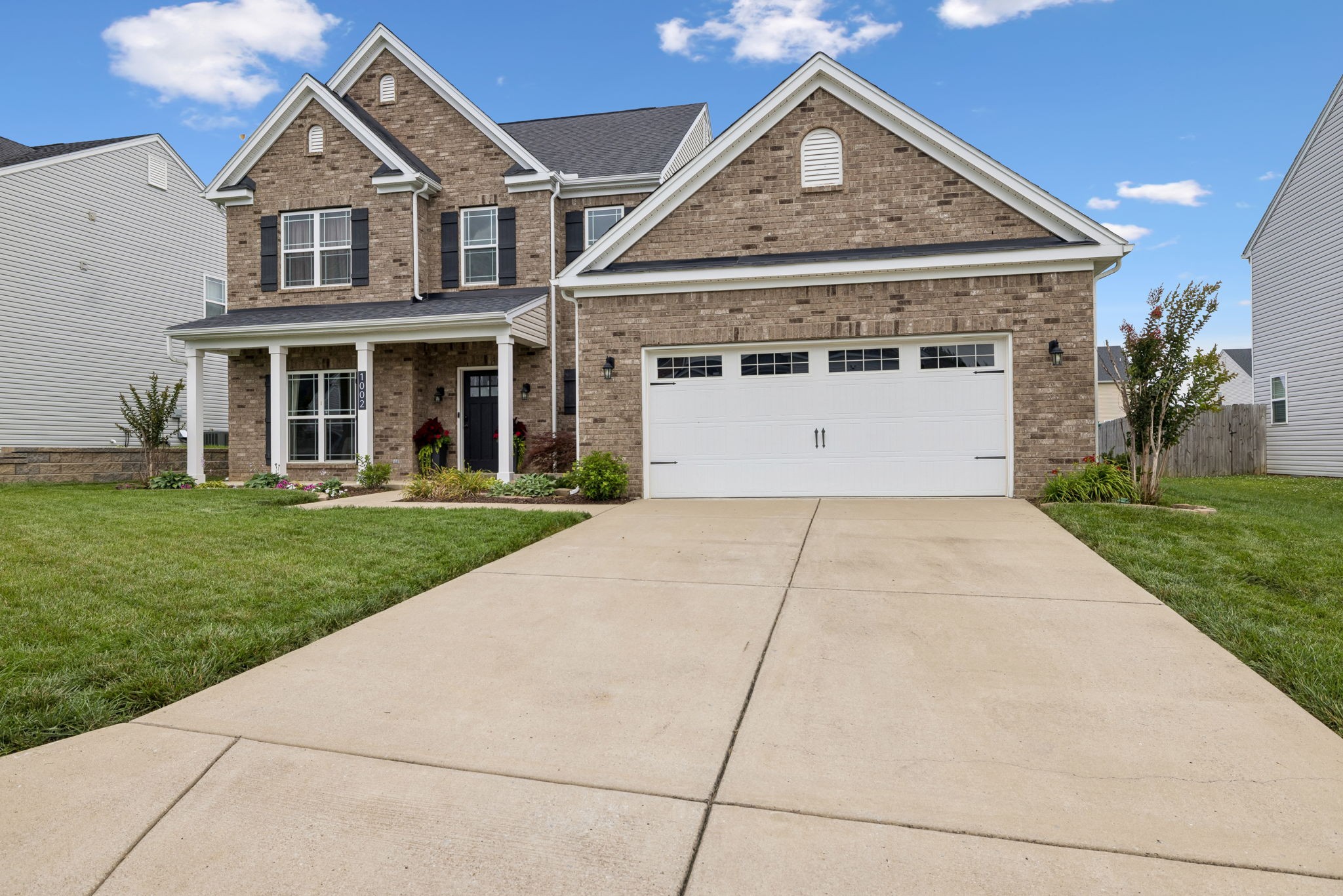 1002 Garrison Way Spring Hill, TN 37174 - Photo 3 of 63 a front view of a house with a yard