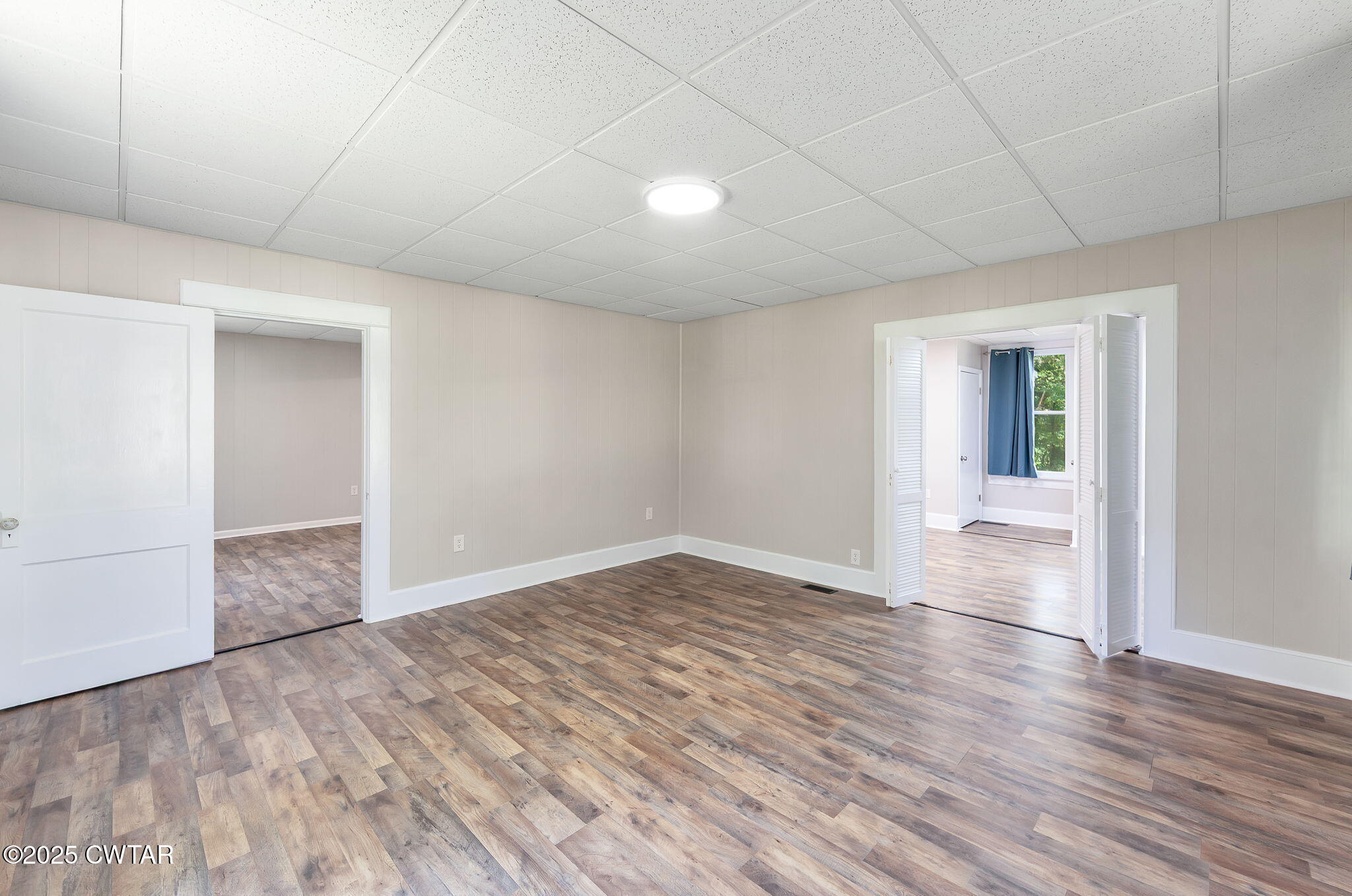 176 Old Denmark Road Jackson, TN 38301 - Photo 19 of 56 wooden floor in an empty room with a window