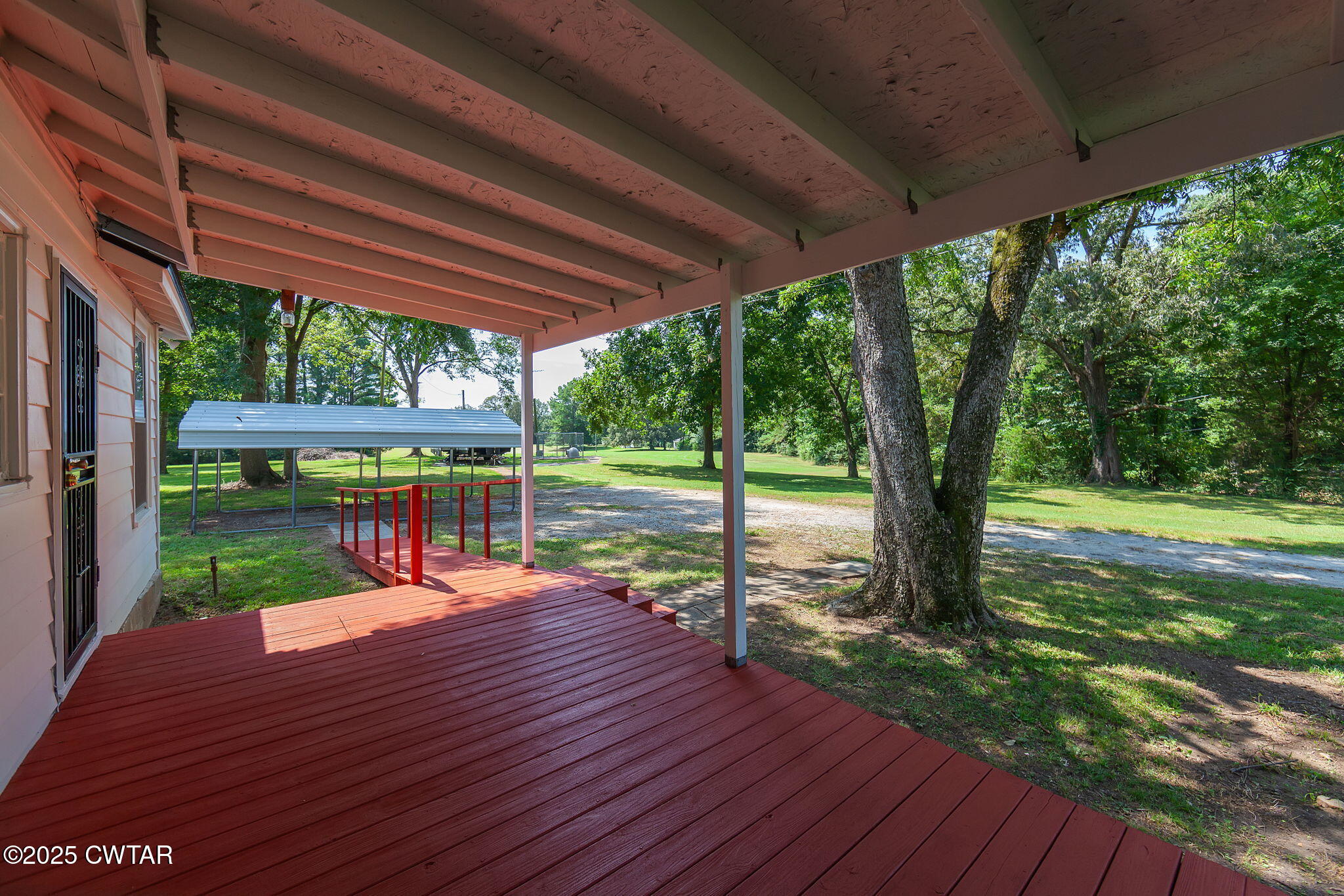 176 Old Denmark Road Jackson, TN 38301 - Photo 26 of 56 a porch with chairs and wooden floor