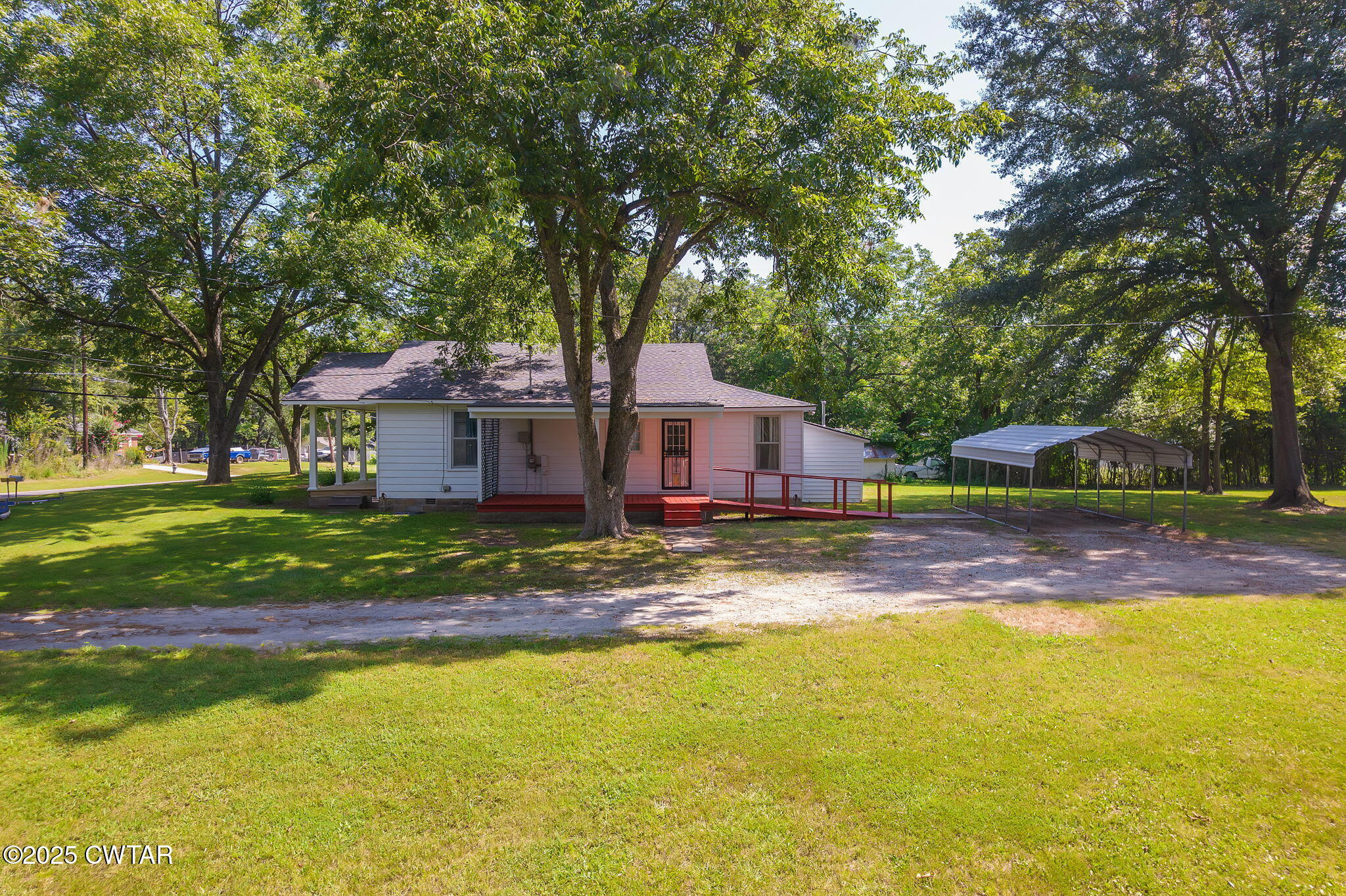 176 Old Denmark Road Jackson, TN 38301 - Photo 32 of 56 a front view of a house with a garden and tree