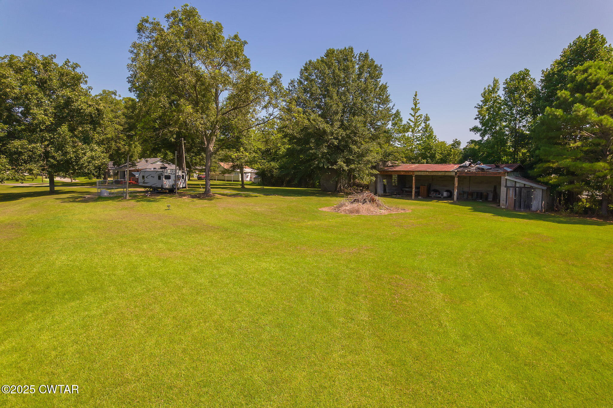 176 Old Denmark Road Jackson, TN 38301 - Photo 34 of 56 a view of a swimming pool with an outdoor seating and house